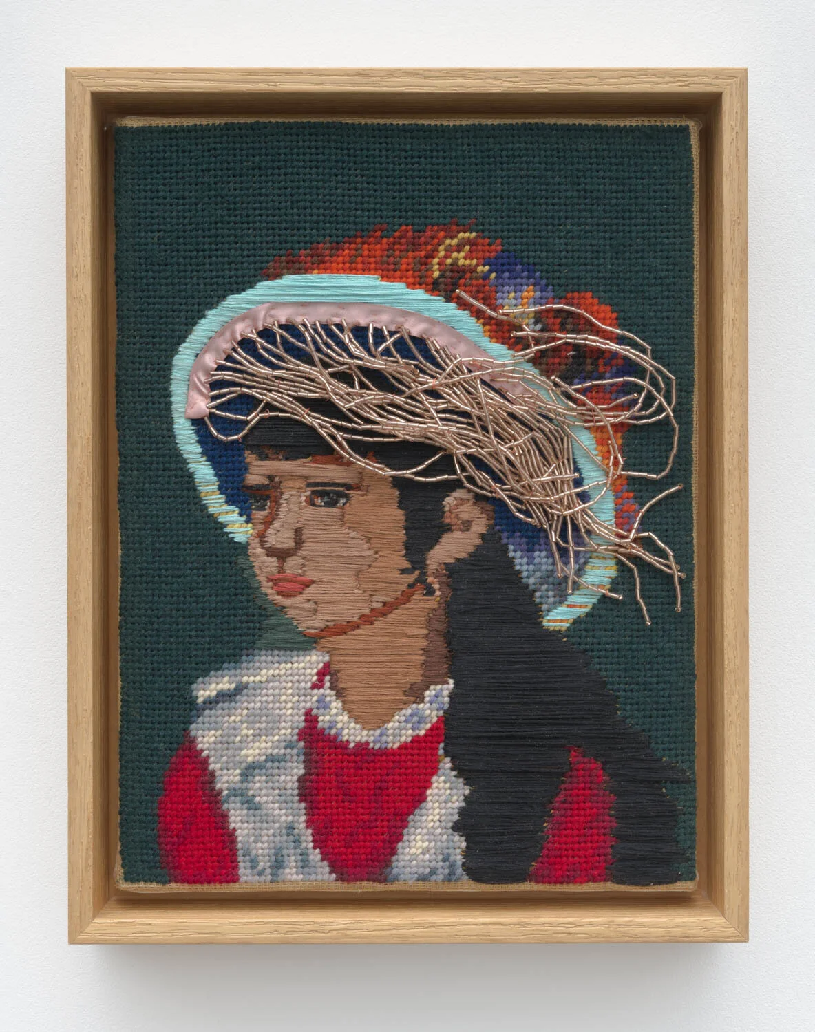 either side of time, 2023, embroidery floss and beaded trim on found needlepoint, 12" x 9"