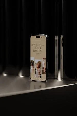Smartphone placed on a reflective surface in front of black curtains, displaying a social media post.