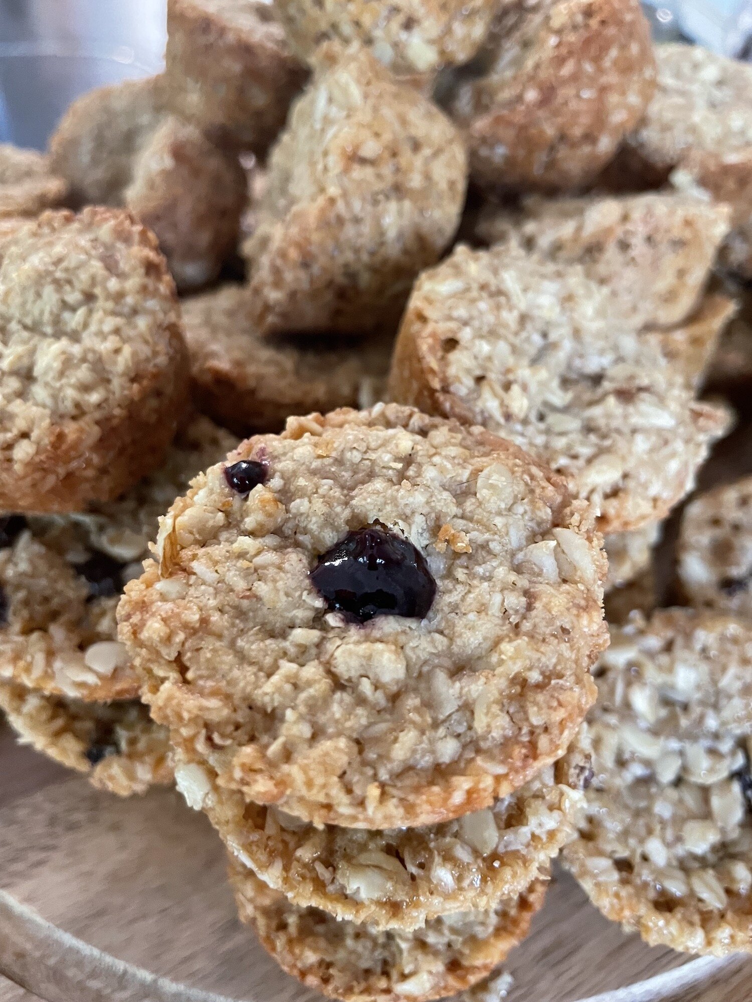 Jam stuffed mini muesli bite with more in background