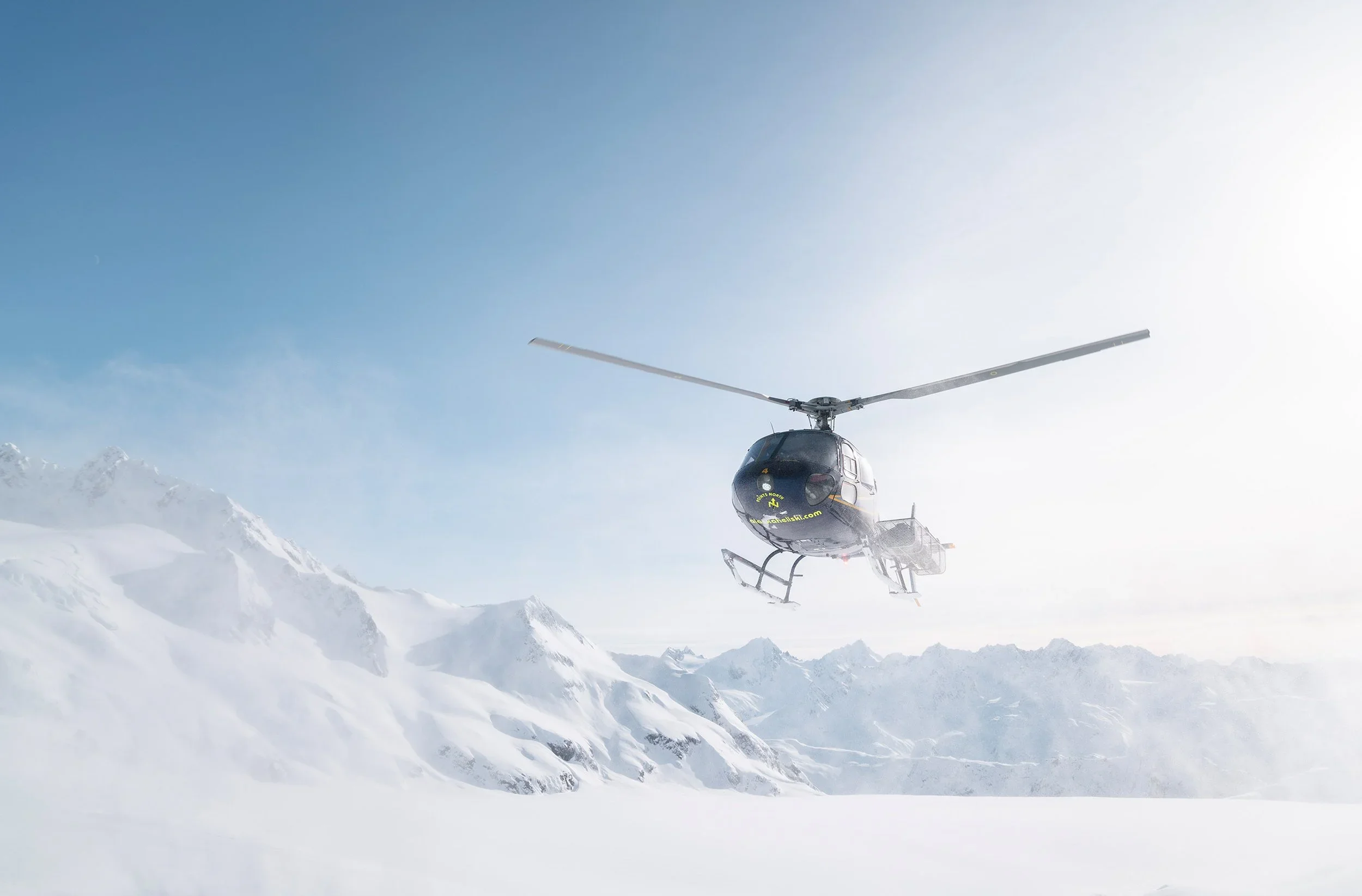 points north helicopter landing for skiers in chugach.webp