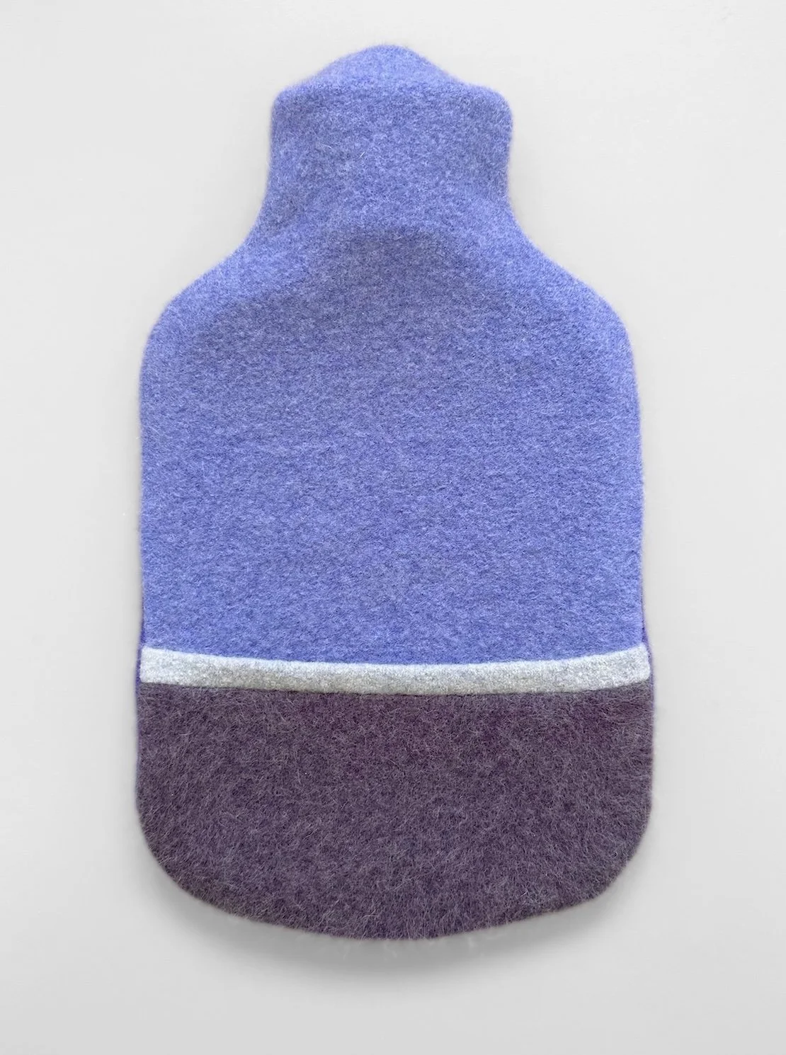 Cashmere hot water bottle in powder blue and warm navy.