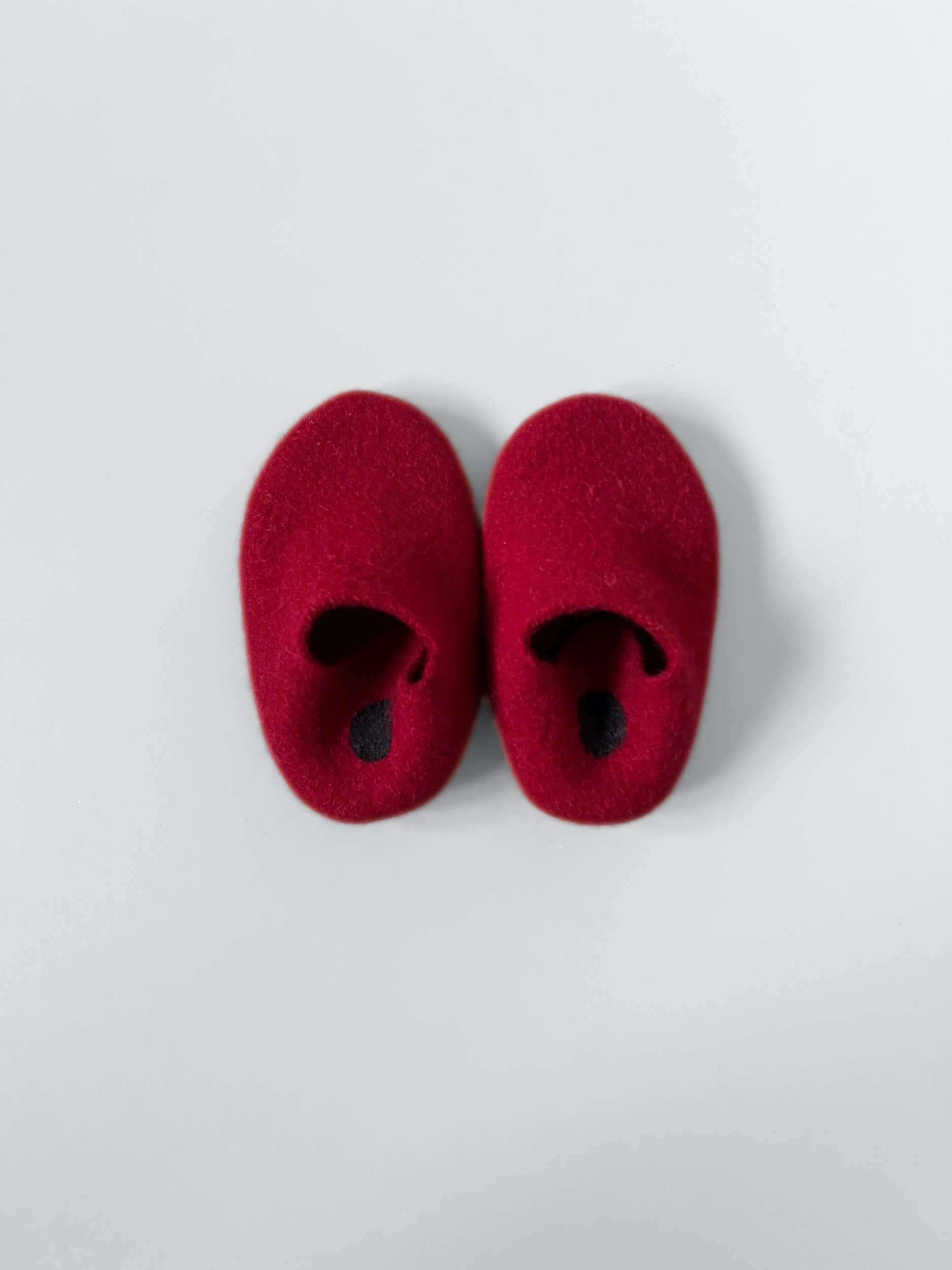 Boiled repurposed wool children's slippers.
