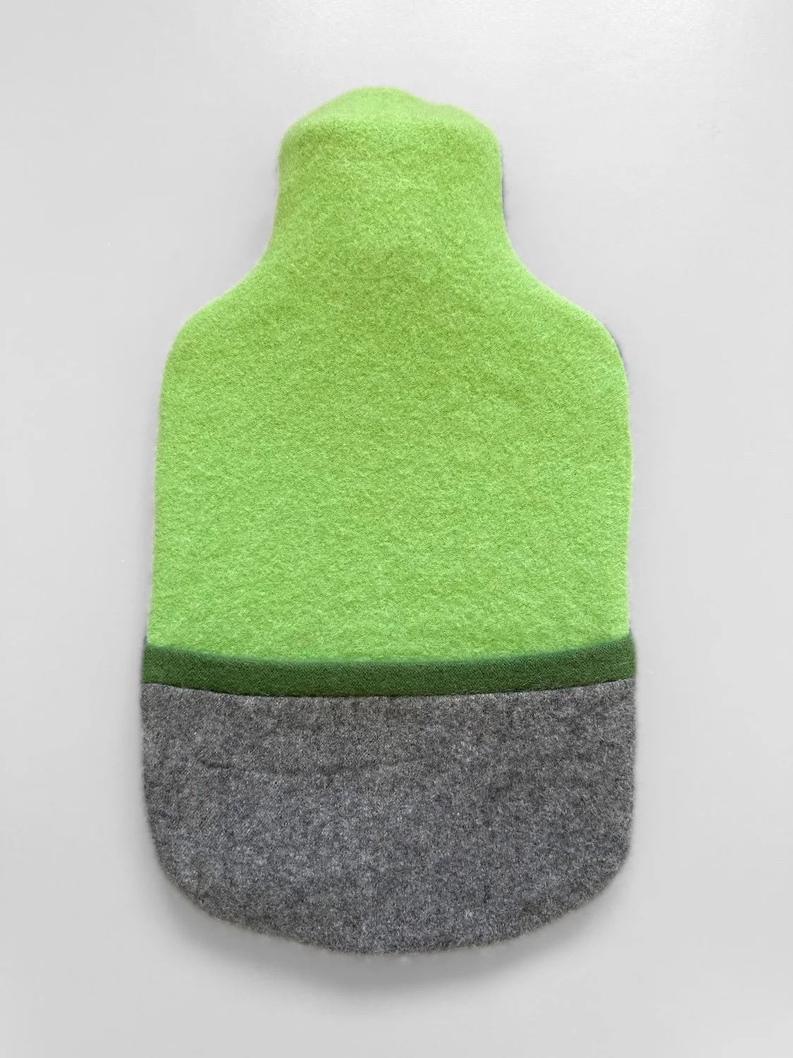 Cashmere hot water bottle cover in green and grey.