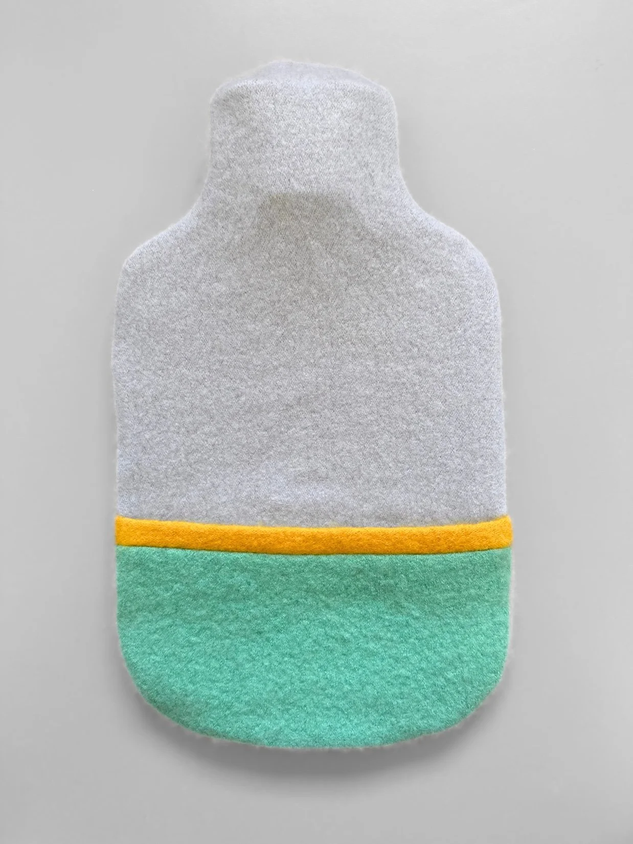 Cashmere hot water bottle cover in aqua and pale blue.