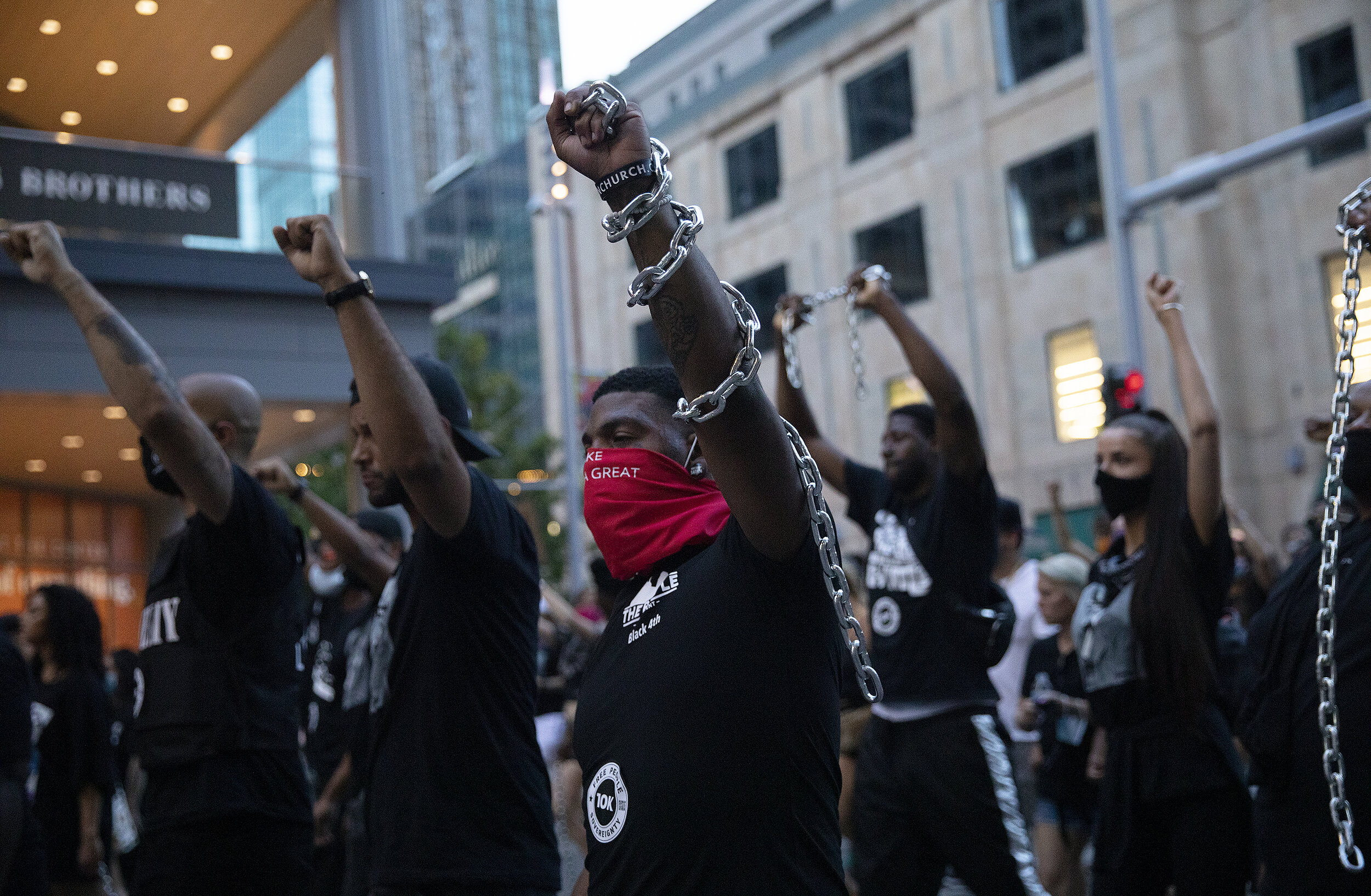  Demonstrators raise their fists during the Black 4th march throughout downtown Minneapolis. “We're really bringing attention to the hypocrisy of the holiday and how many of us were not independent," said Tayo Daniel, a co-founder of 10K Foundation. 