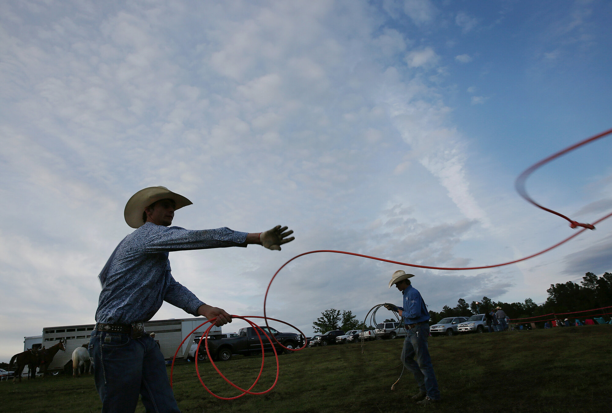  From left, Jacob Heath and Dylan Ray, both of Yadkin County, practice before the team roping competition.  