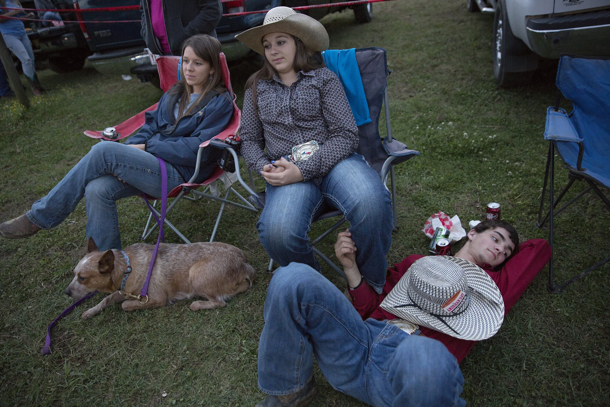  From right Josh Parker and Julie Layell relax with Julie's sister, Kaylee, after competing during the Jeff Hinson Memorial Rodeo. 