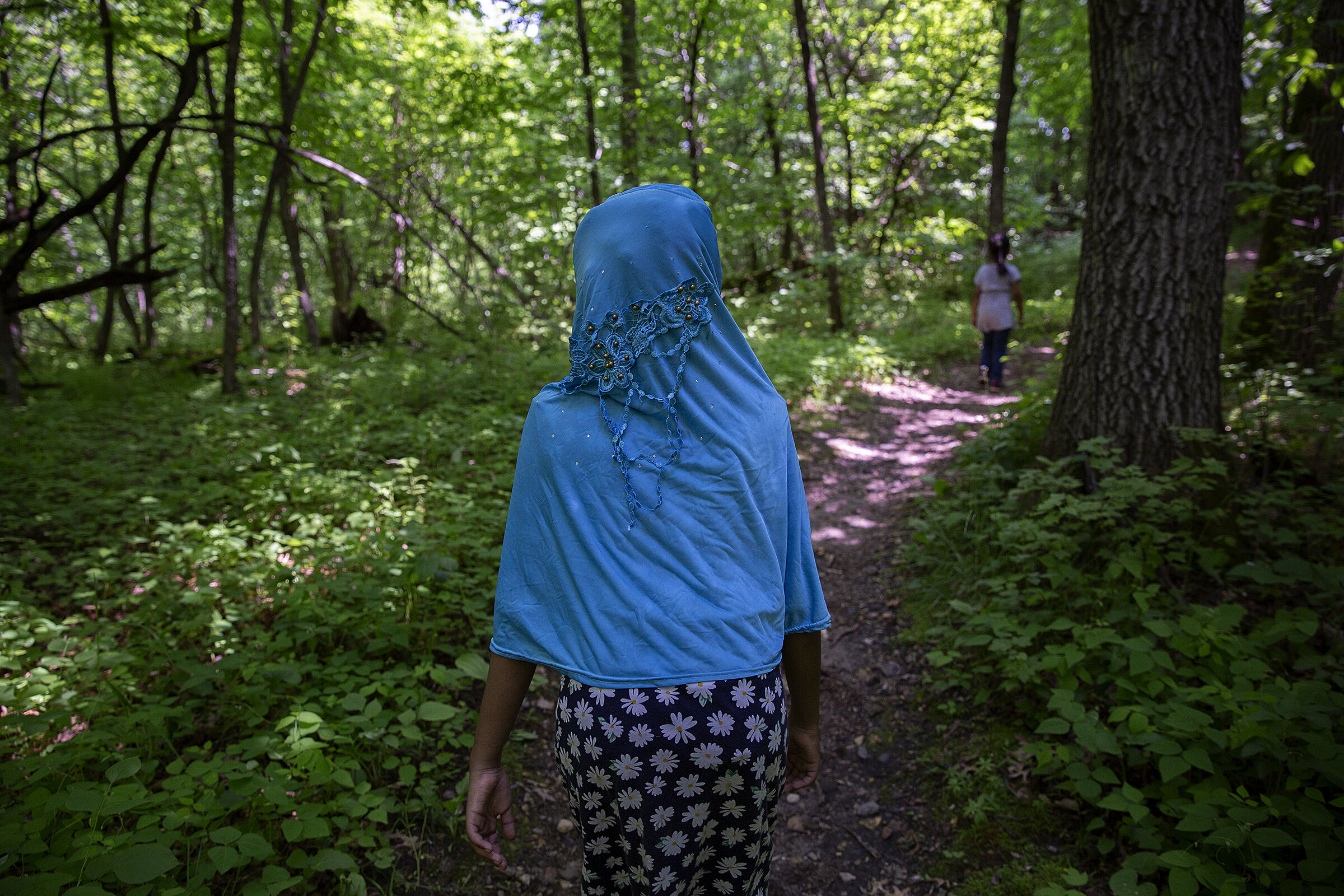  Hanan Samatar hikes on a trail at Sibley State Park. Youth and Family Circle co-founders Mahmud Kanyare and Mahdi Osman said they started the non-profit after attending camp as kids and falling in love with outdoor recreation. 