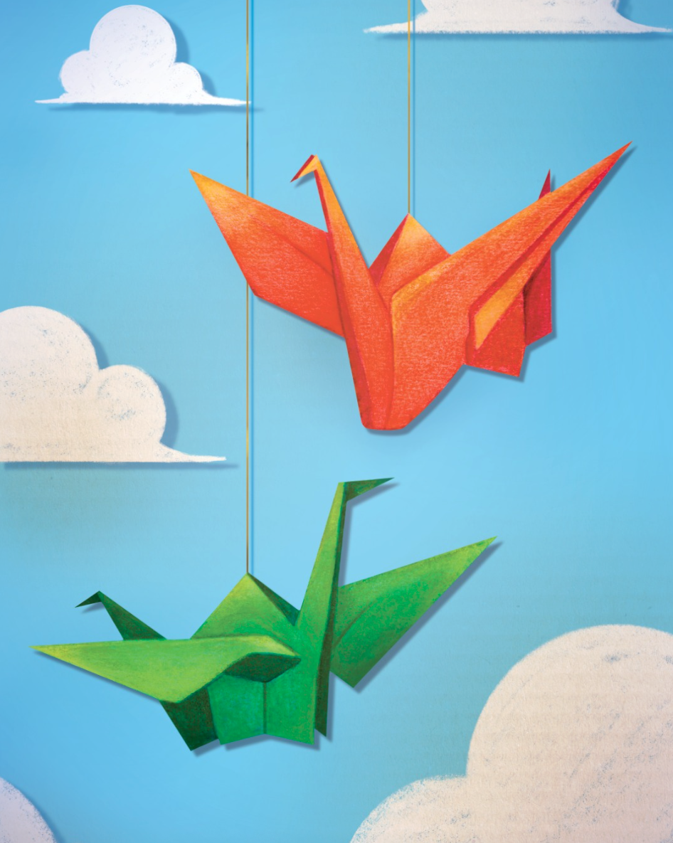 Origami-style red and green paper cranes hanging from strings against a light blue sky with white clouds.