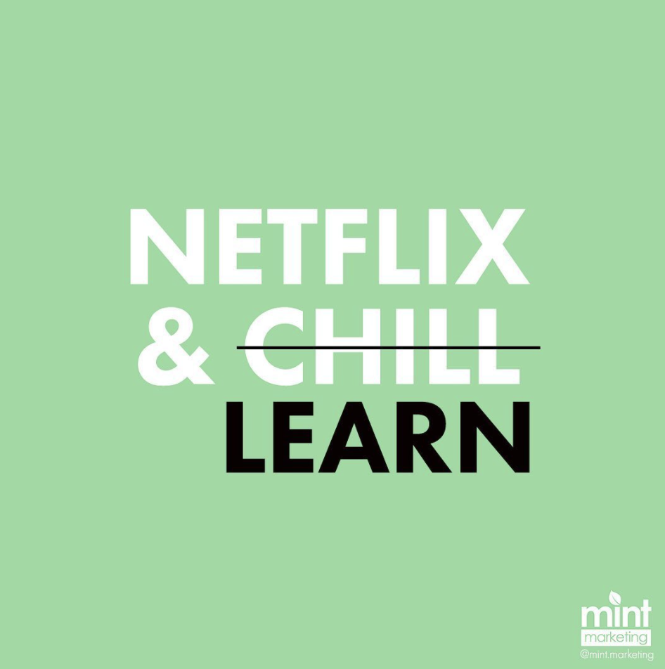 Happy smiling woman with curly hair lounging on couch.