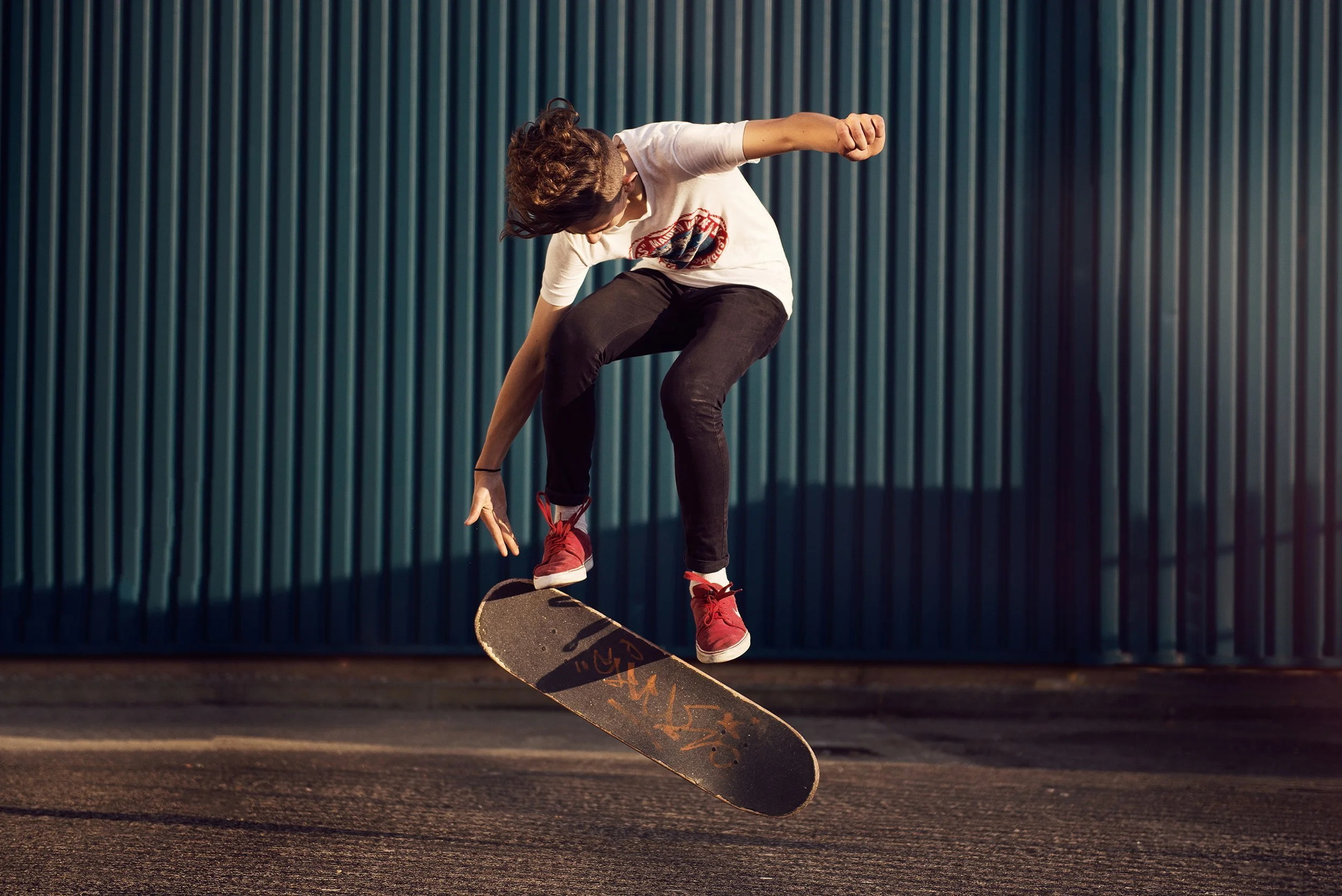 boy+doing+kickflip+with+skateboard+by+nathaniel+rosa.jpg