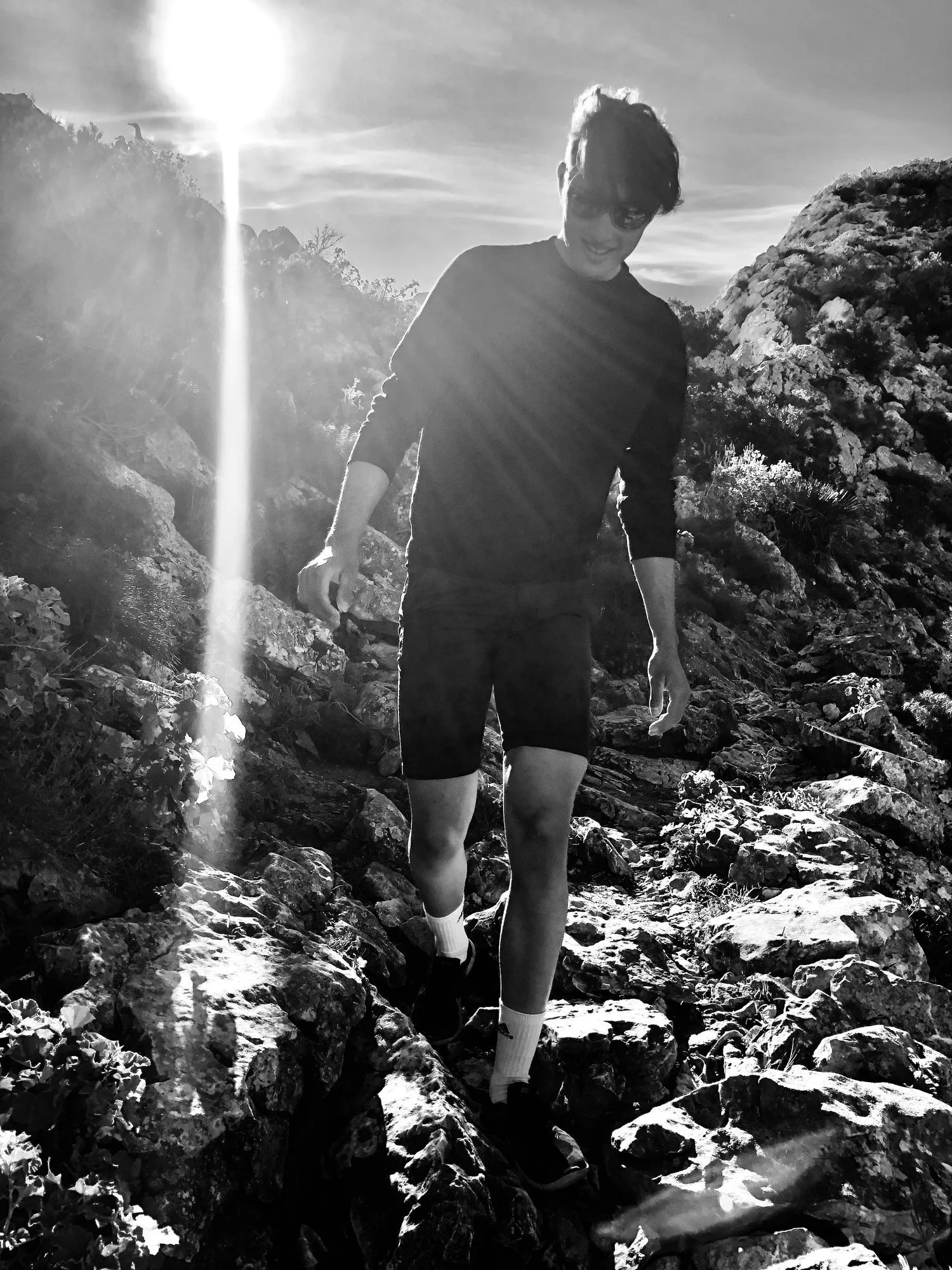 good+looking+guy+walking+down+a+rocky+descent+by+Nathaniel+Rosa.jpg