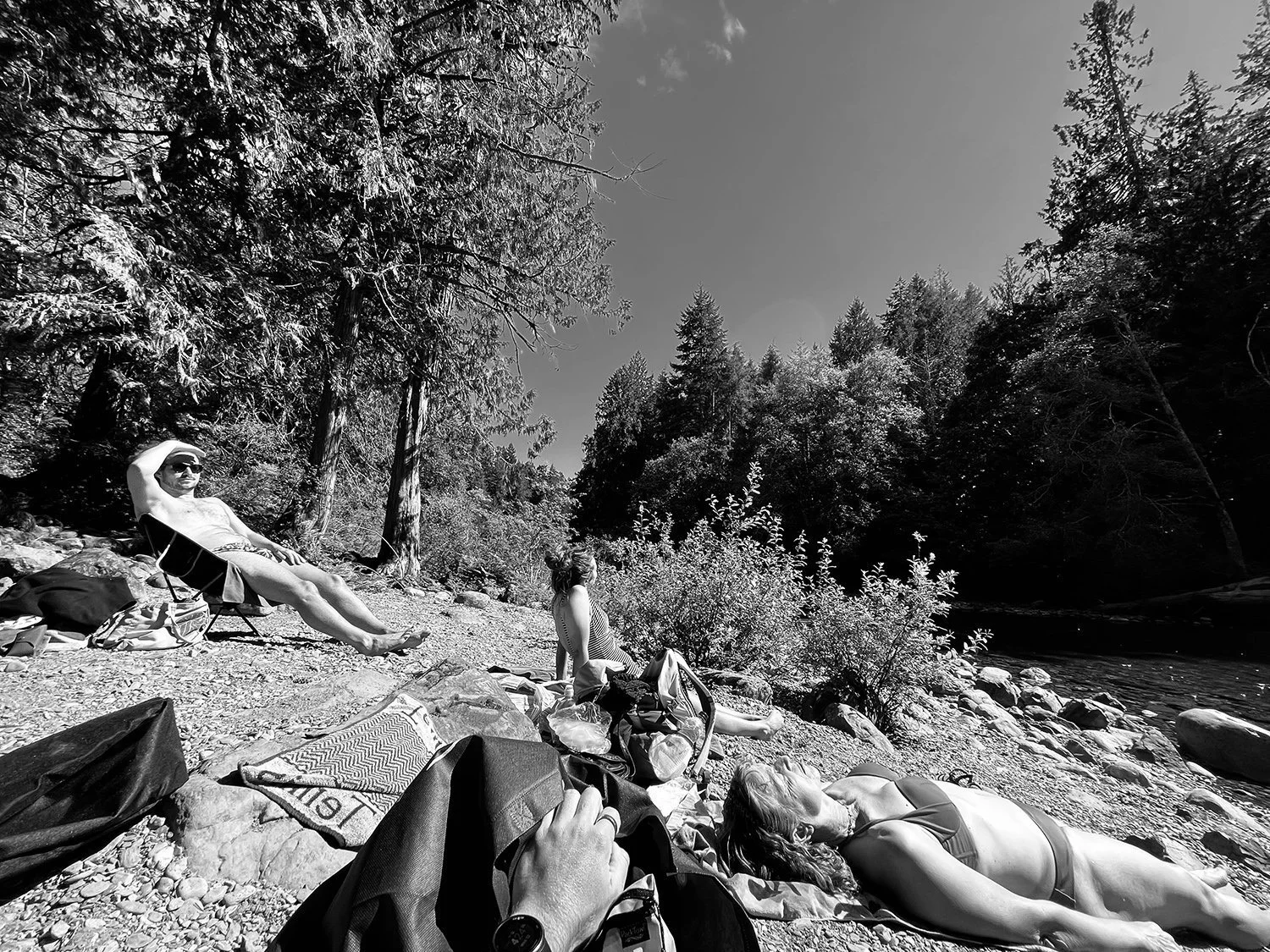 family+lying+down+by+the+side+of+a+lake+by+Nathaniel+Rosa+shot+on+iphone.jpg