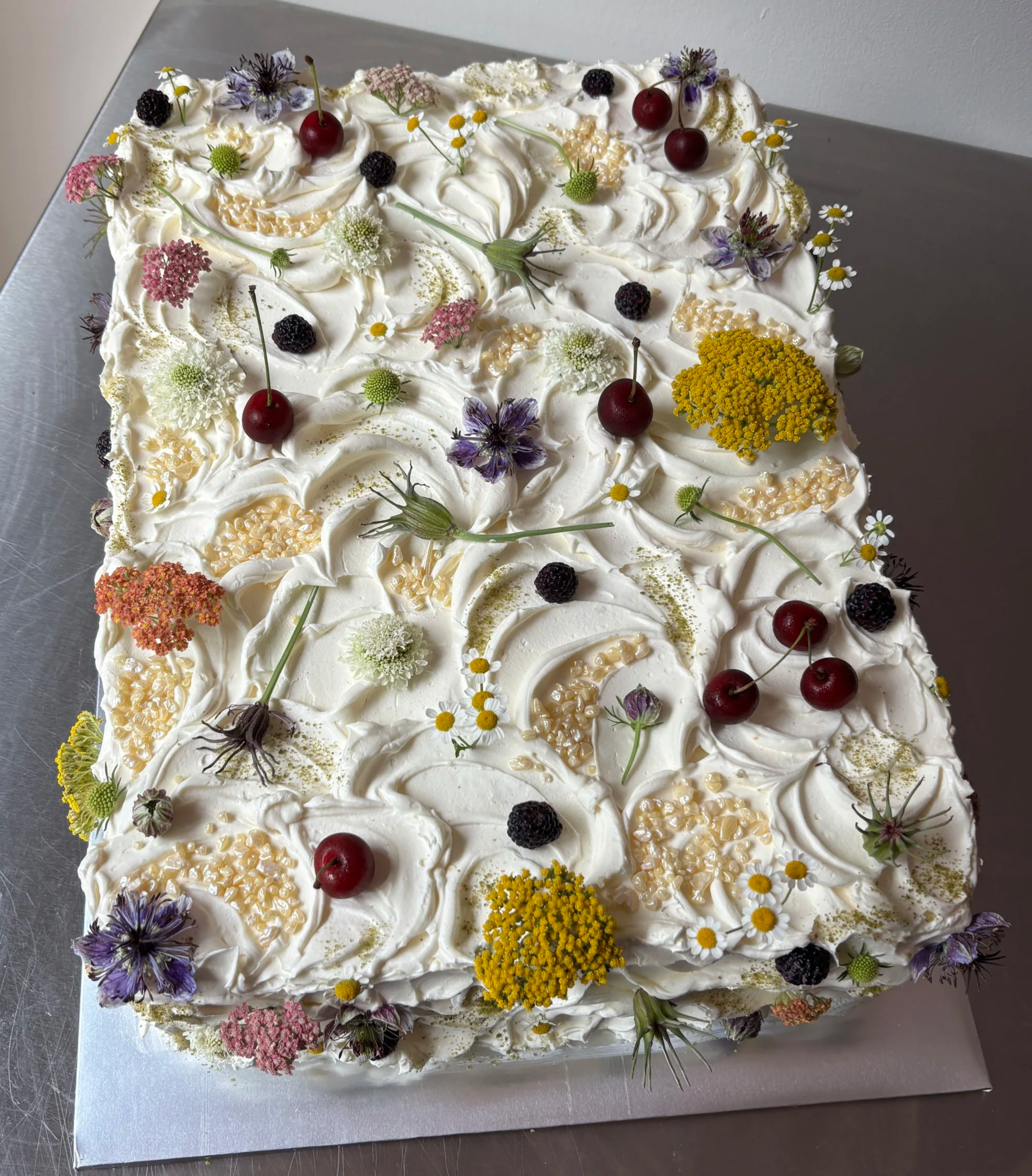 E & S 
meyer lemon turmeric cake / pickled berry jam / basil swiss meringue buttercream (half sheet cake)