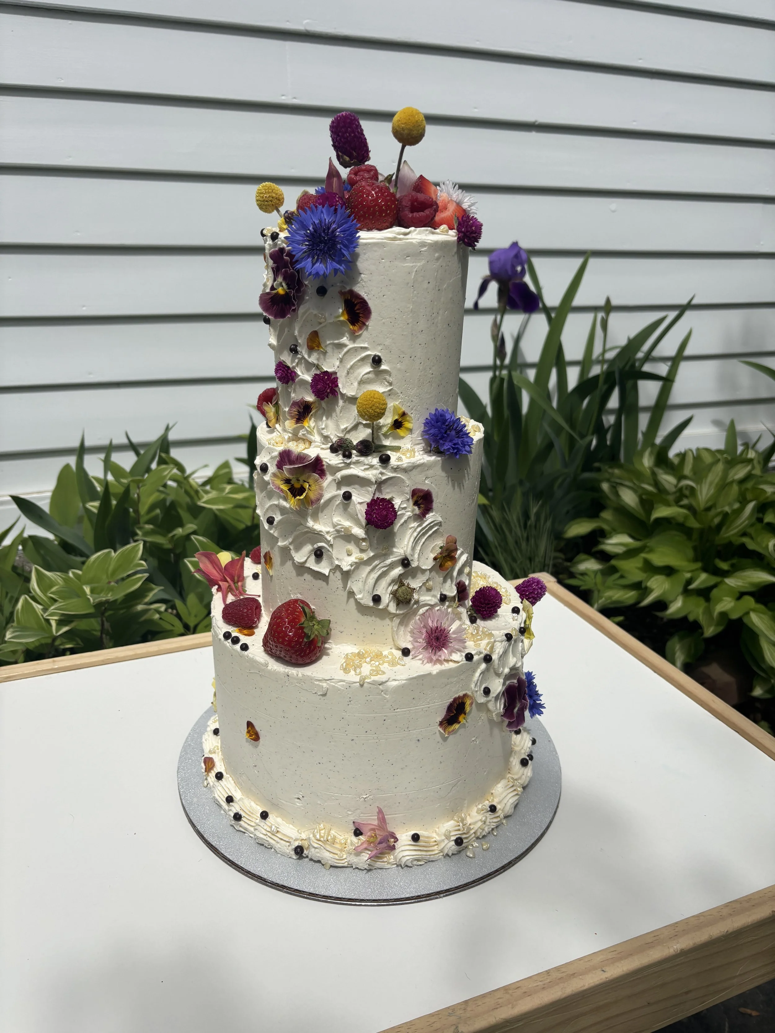 A & D  
almond marble cake / pickled berry jam / fresh macerated strawberries and raspberries / brown butter tonka bean swiss meringue buttercream (serves 45)