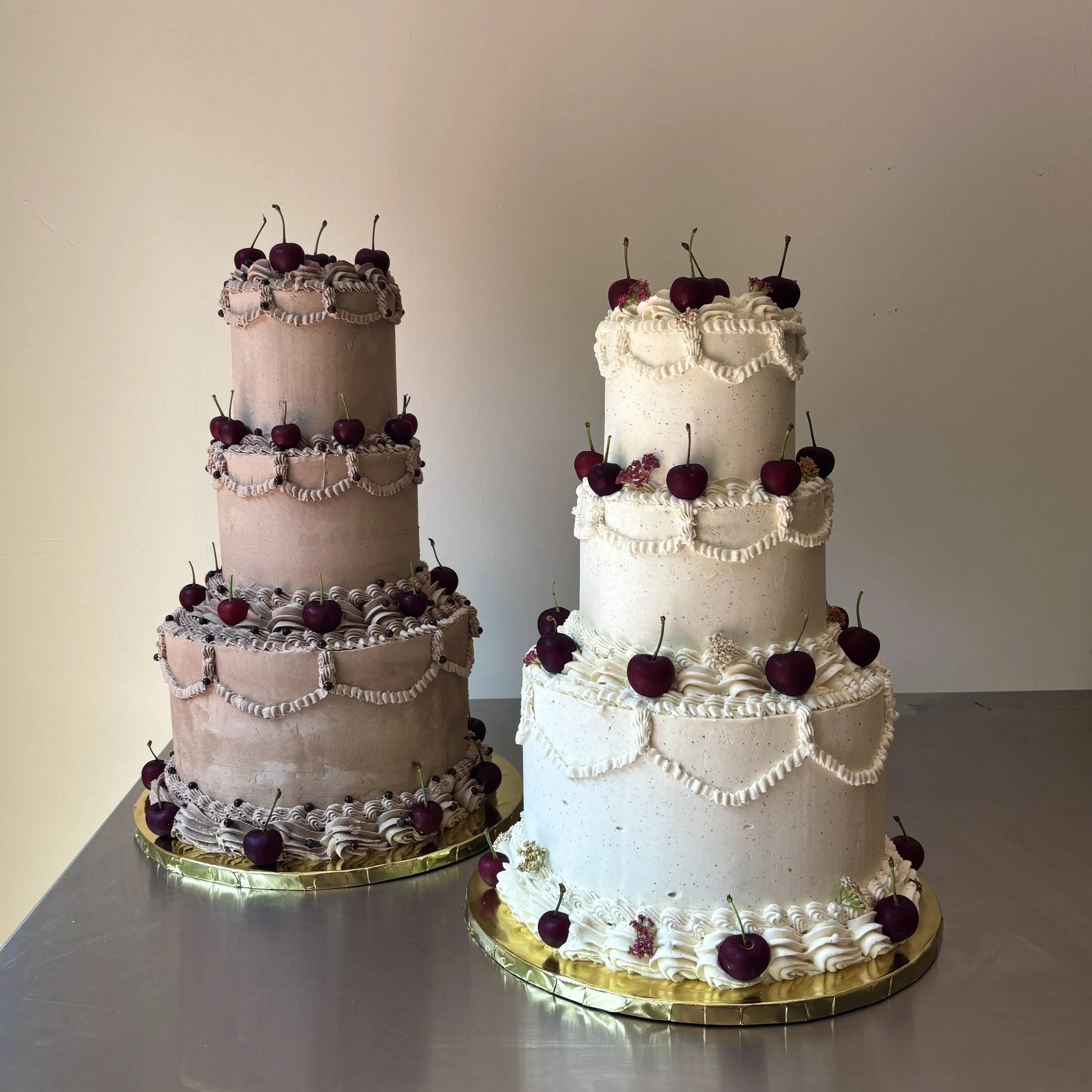 K & C 
1. almond marble cake / spiced chocolate crumbs / spiced hazelnut chocolate spread / cardamom mocha swiss meringue buttercream 
2. pistachio cake / black raspberry jam / brown butter tonka bean swiss meringue buttercream (each cake serves 40)