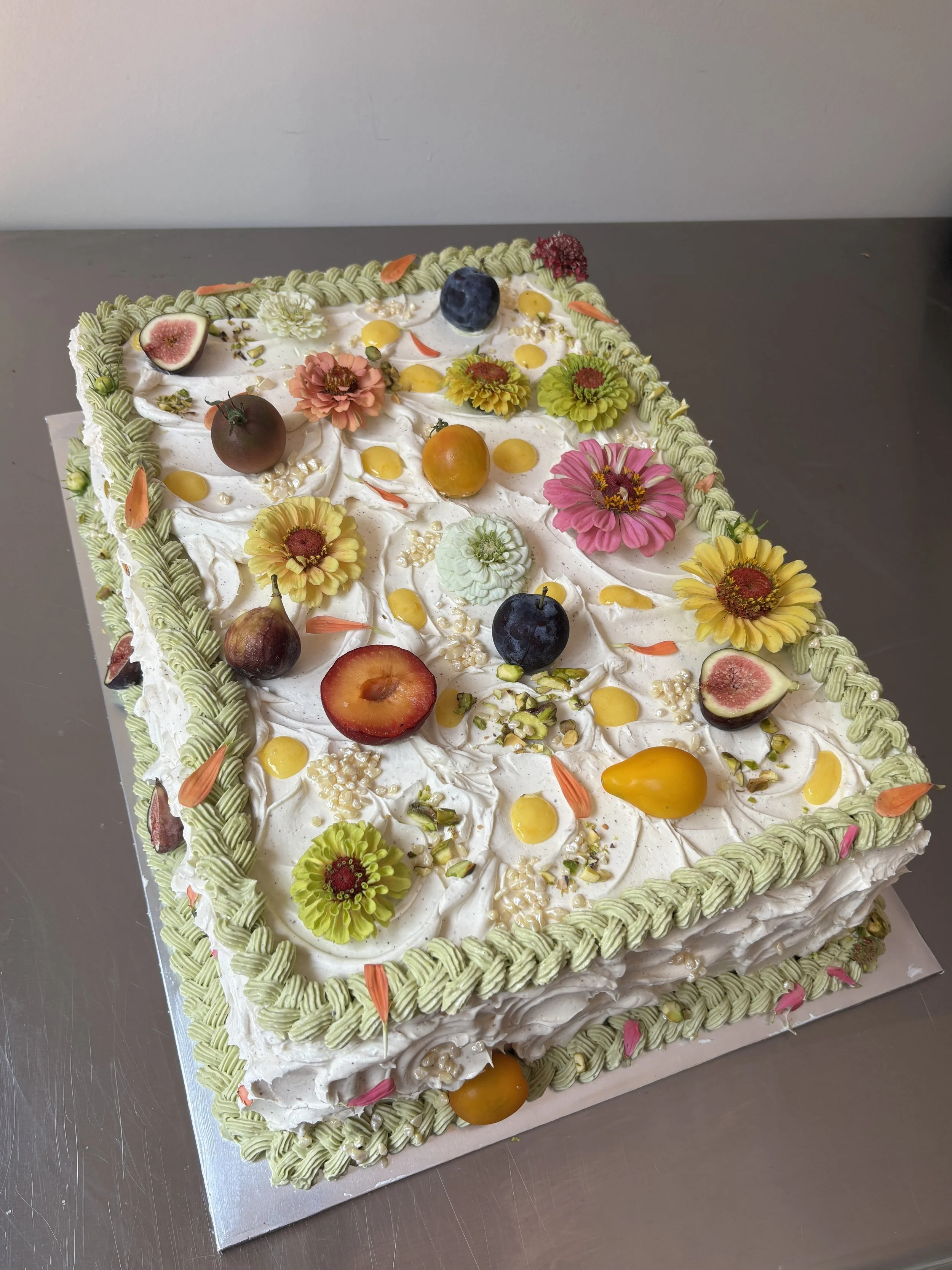 L & C 
pistachio cake / meyer lemon curd / brown butter tonka bean swiss meringue buttercream (half sheet cake)