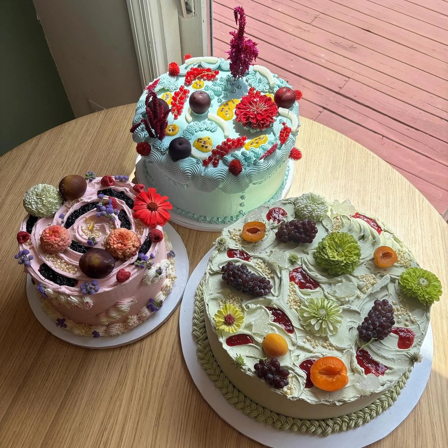 A & C 
1. malted strawberry cake / vanilla stonefruit jam / brown butter tonka bean swiss meringue buttercream (green) (14 inch round) 
2. passion fruit cake / passion fruit curd / toasted coconut swiss meringue buttercream (blue) (12 inch round) 
3.