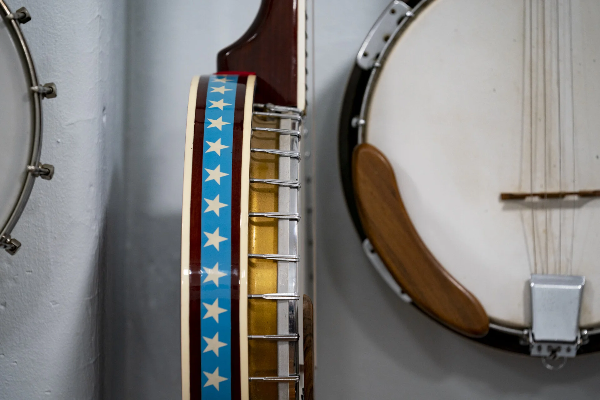 A decorated banjo hanging off the wall in the music lending library in what was previously the Rome-Canaan middle school, in Stewart, Ohio. Theresa Lackey started the program four days after she had retired nine years ago. “You need an instrument to