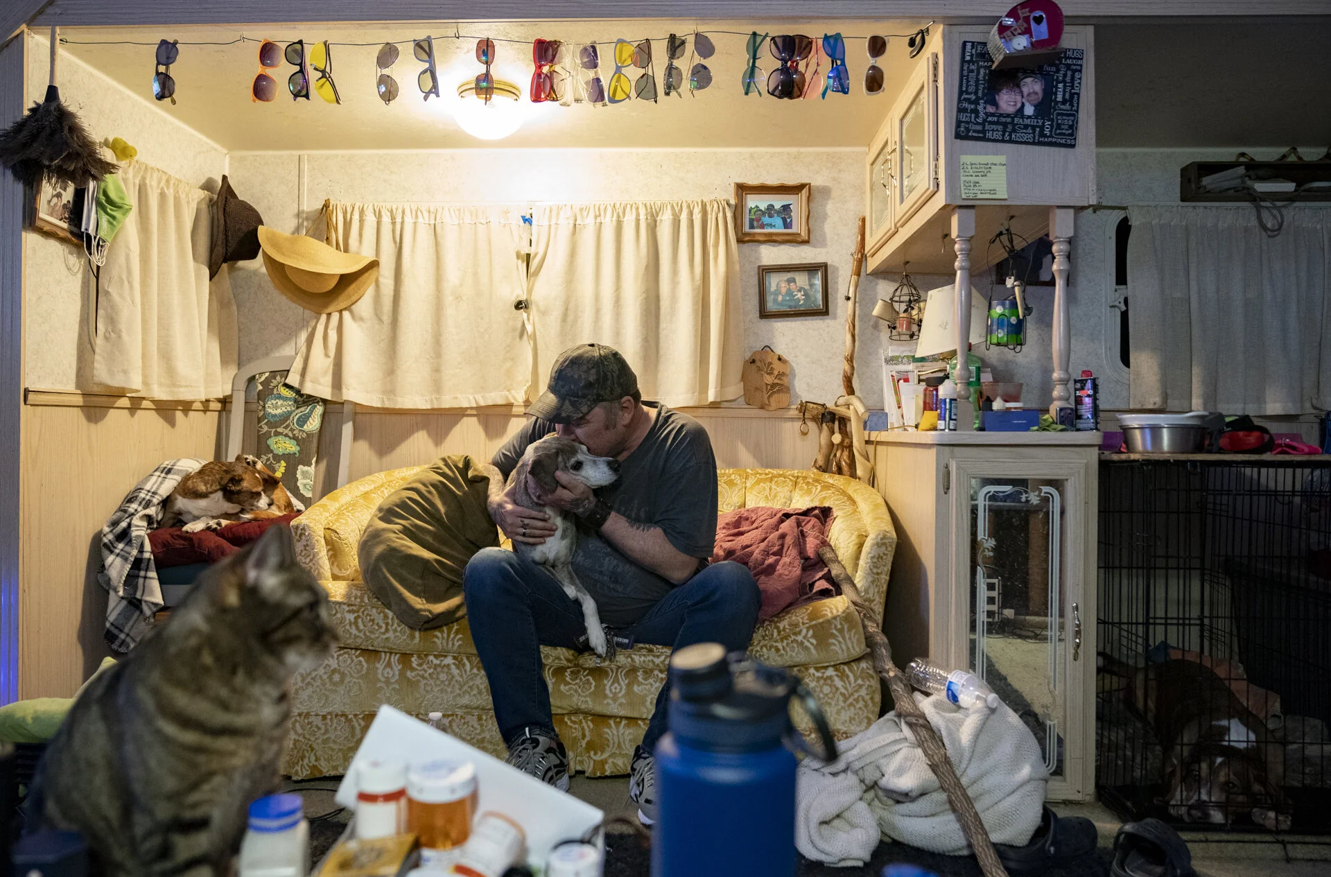  Rodney Brown gives one of his and his wife Crystal’s 14 rescue animals, Maya, a kiss on the head, inside their home in Stewart, Ohio. “When you buy from a puppy mill, you’re just supporting that whole thing,” says Crystal. “When you buy a rescue Pit