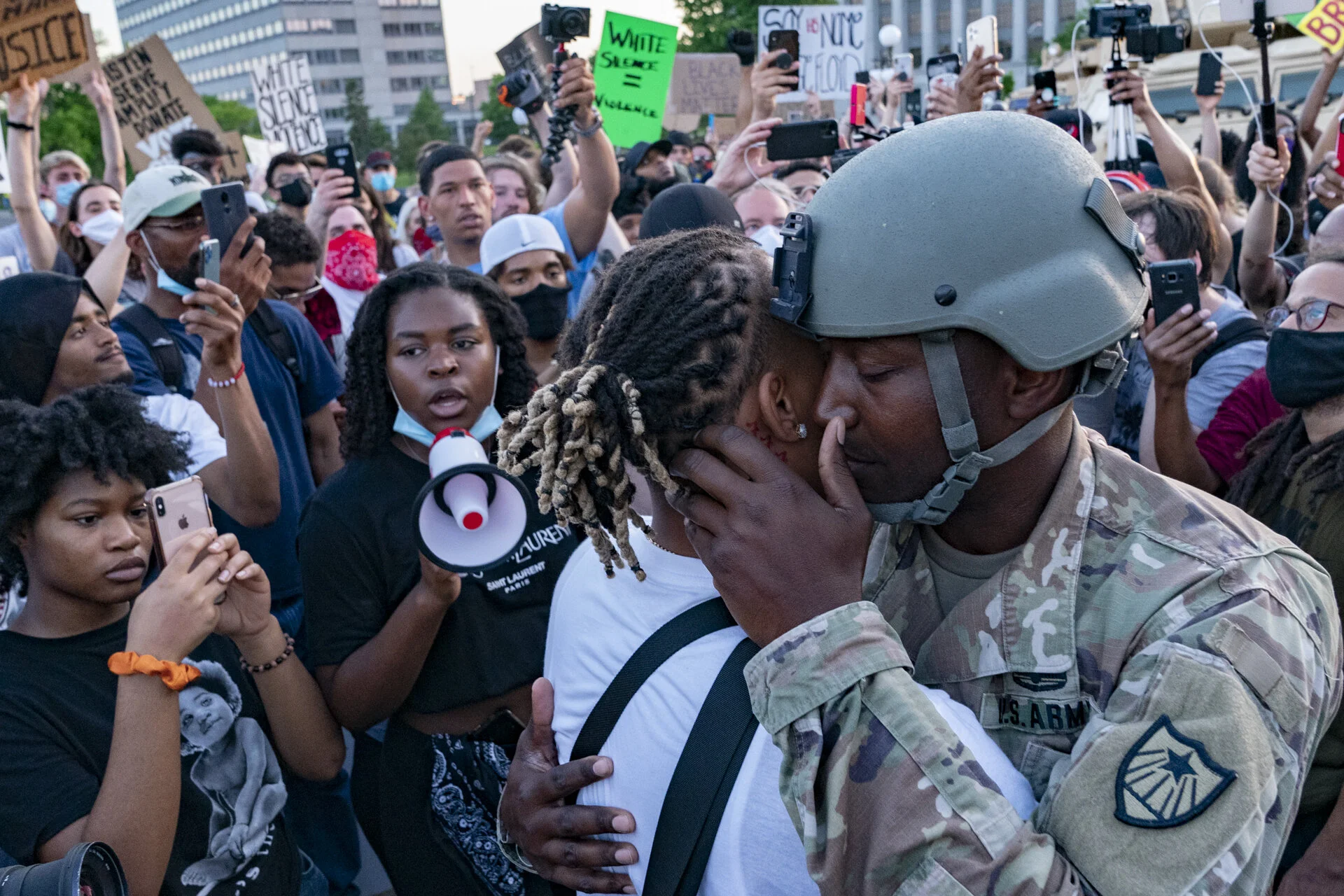  National Guard Master Sgt. Acie Matthews Jr. hugs a protester outside of the Minnesota State Capital on June 1, 2020 after addressing the crowd that had marched there from the governor’s mansion as protests for George Floyd’s death in police custody