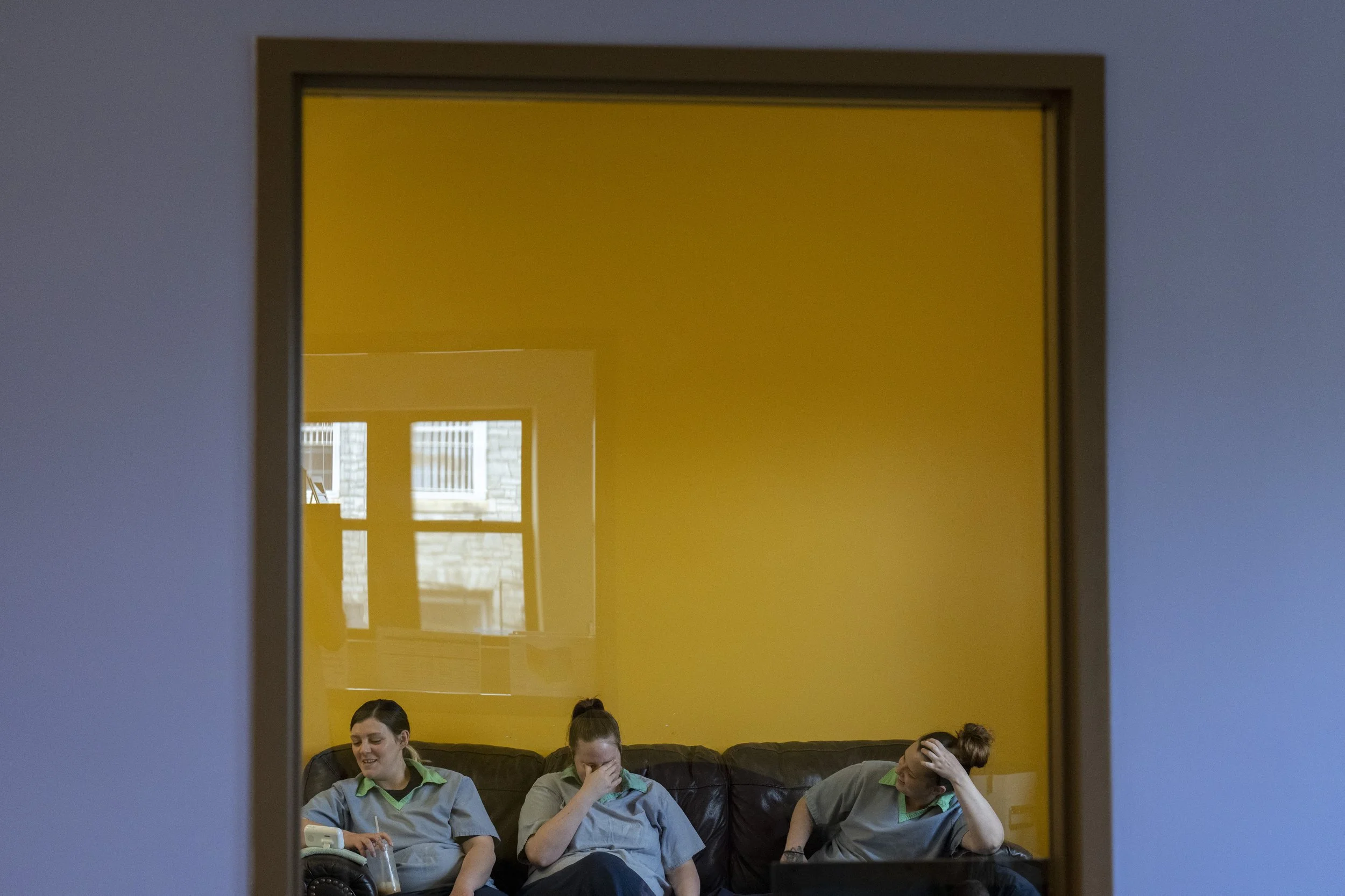 Shaina Alloway, left, Reese Reed and Morgan Brodt joke with each other while watching a baby monitor inside of the Hope House at the Ohio Women's Reformatory, in Marysville.