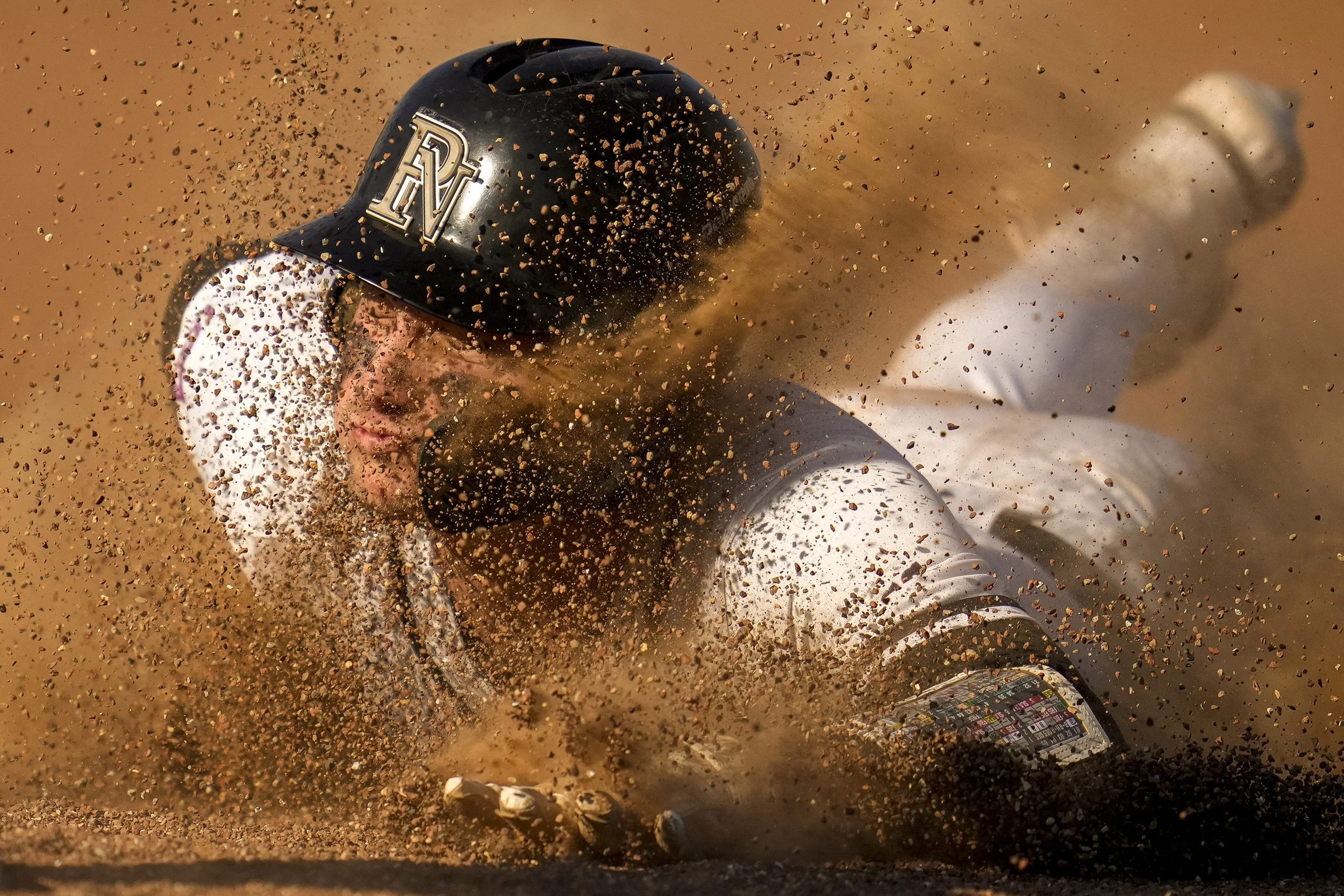  Pickerington North's Riley Jenkins (2) slides into third base during the baseball game between Pickerington North and Gahanna Lincoln at Pickerington High School North, Ohio on Wednesday evening, April 26, 2023. 