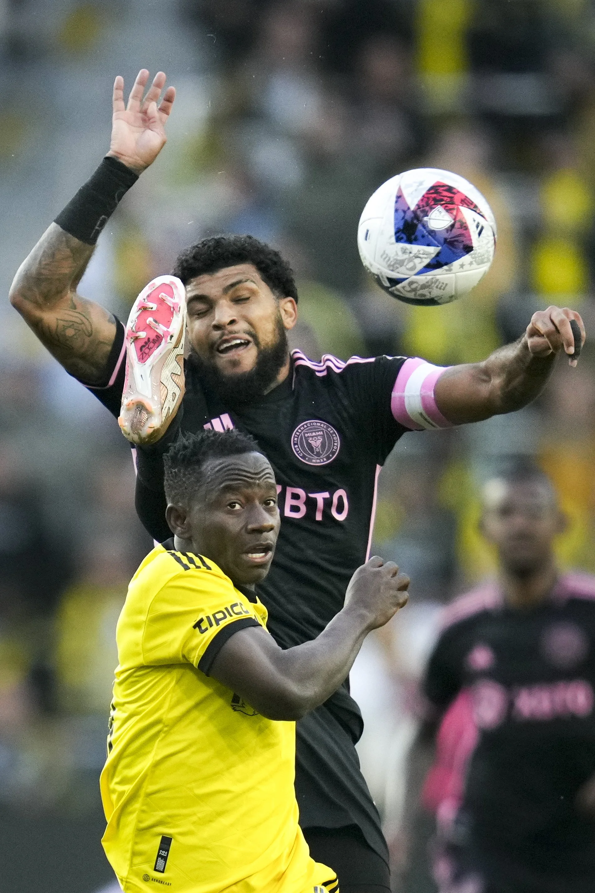  Apr 29, 2023; Columbus, Ohio, United States;  Columbus Crew midfielder Yaw Yeboah (14) contests the ball with Inter Miami defender DeAndre Yedlin (2) during the first half of the MLS soccer game between Columbus Crew and Inter Miami at Lower.com Fie