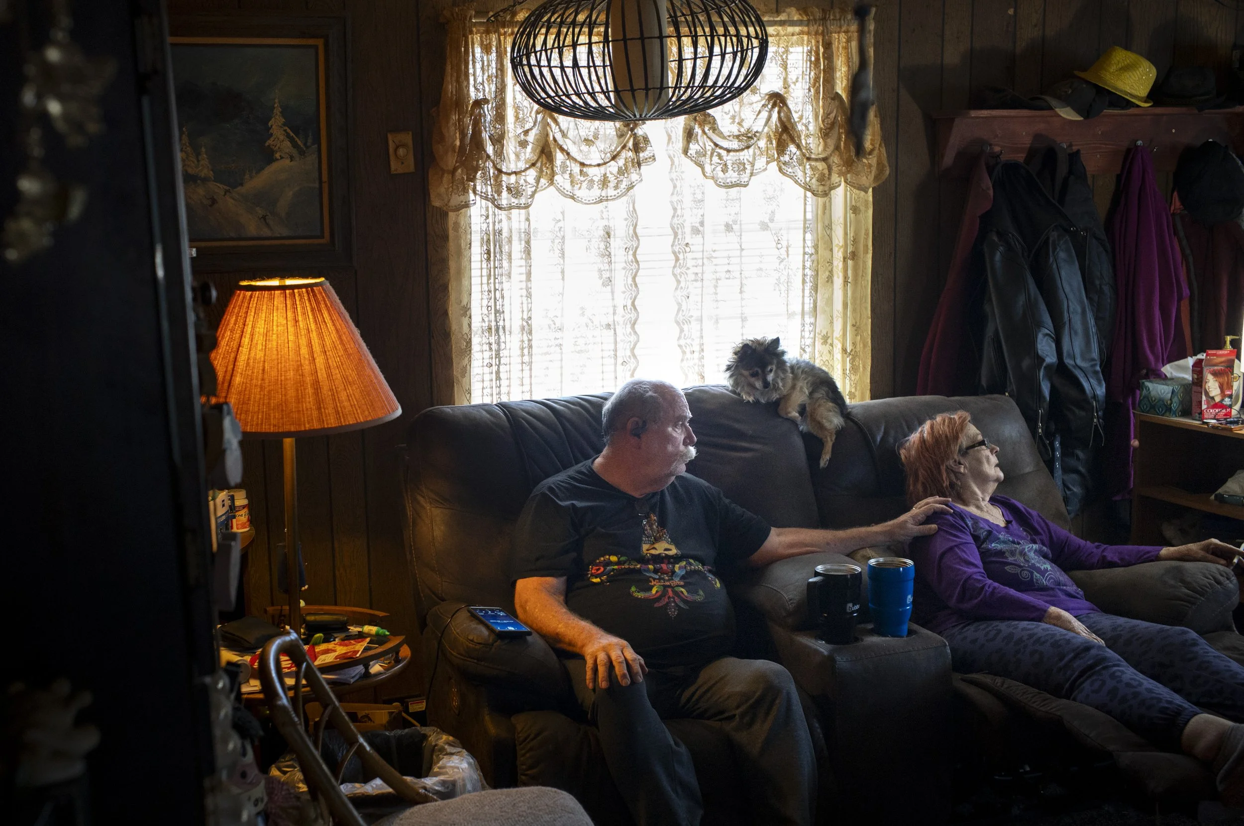  Wayne Roberts reaches over and touches his wife Lynne Roberts’ shoulder as she gazes out a window in their home in Butte. “I’ve been preparing for this for 13 years,” Wayne said while speaking about being Lynne’s caregiver. “She was 9 years older th