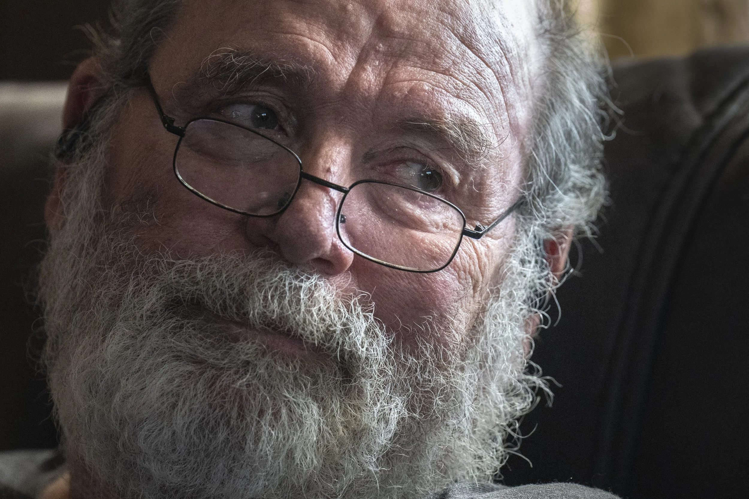  Wayne Roberts looks over at  Lynne Roberts after she completed an in-home occupational therapy session on Monday, Feb. 5, 2024. When Wayne first moved in with Lynne, all he had was a bag of clothes and a stick bag for his drum sticks. “I’m not just 