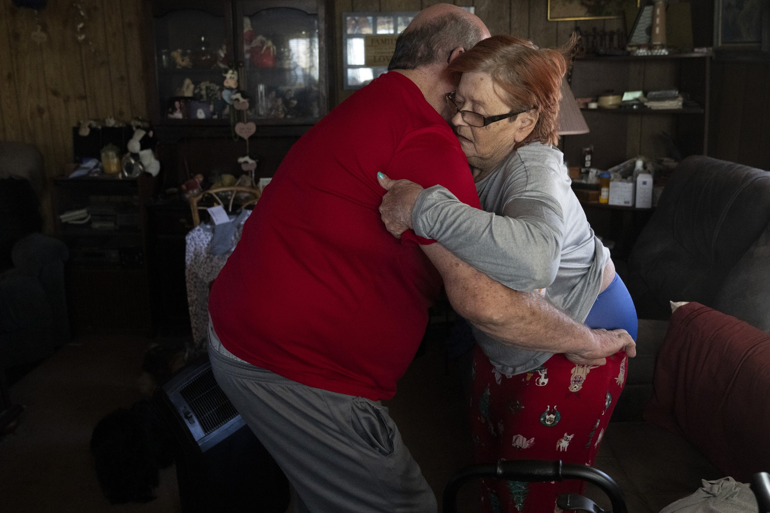  Wayne helps Lynne try on a pair of pajamas they purchased at Walmart. Lynne’s limited mobility makes changing her own clothes difficult. 
