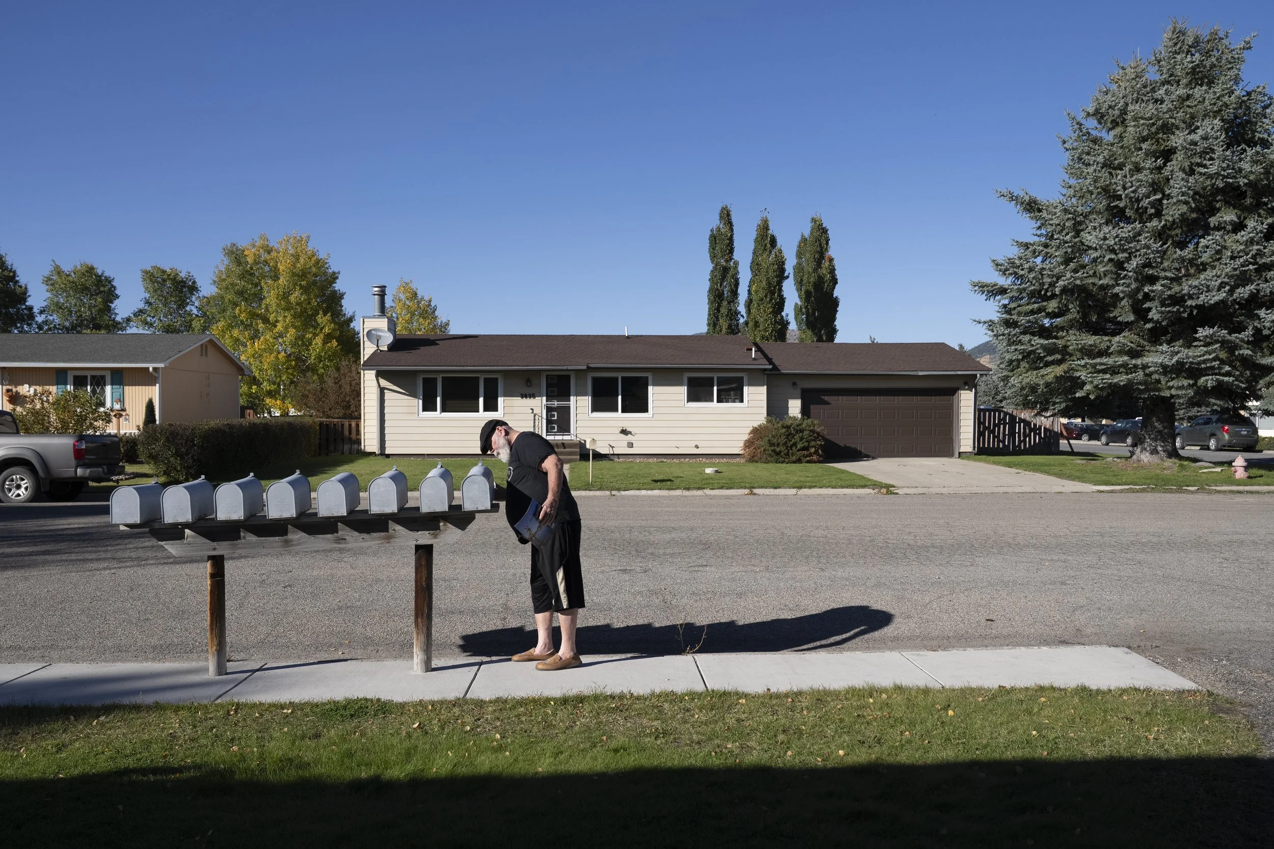  Six months after Lynne’s death and living in a new home, Wayne checks the mail before starting his day. 
