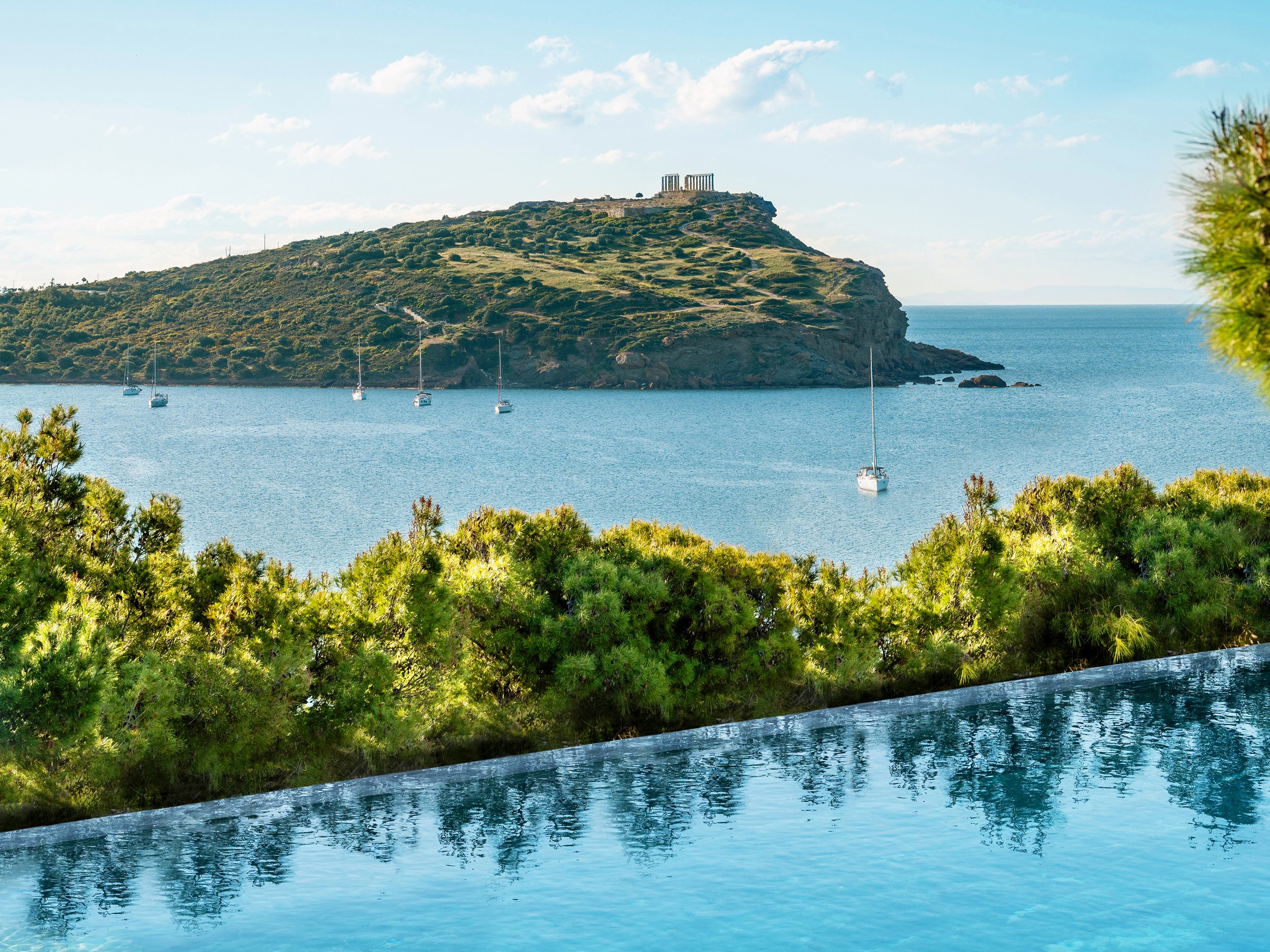 02-luxury-pool-with-views-of-the-temple-of-poseidon.jpg