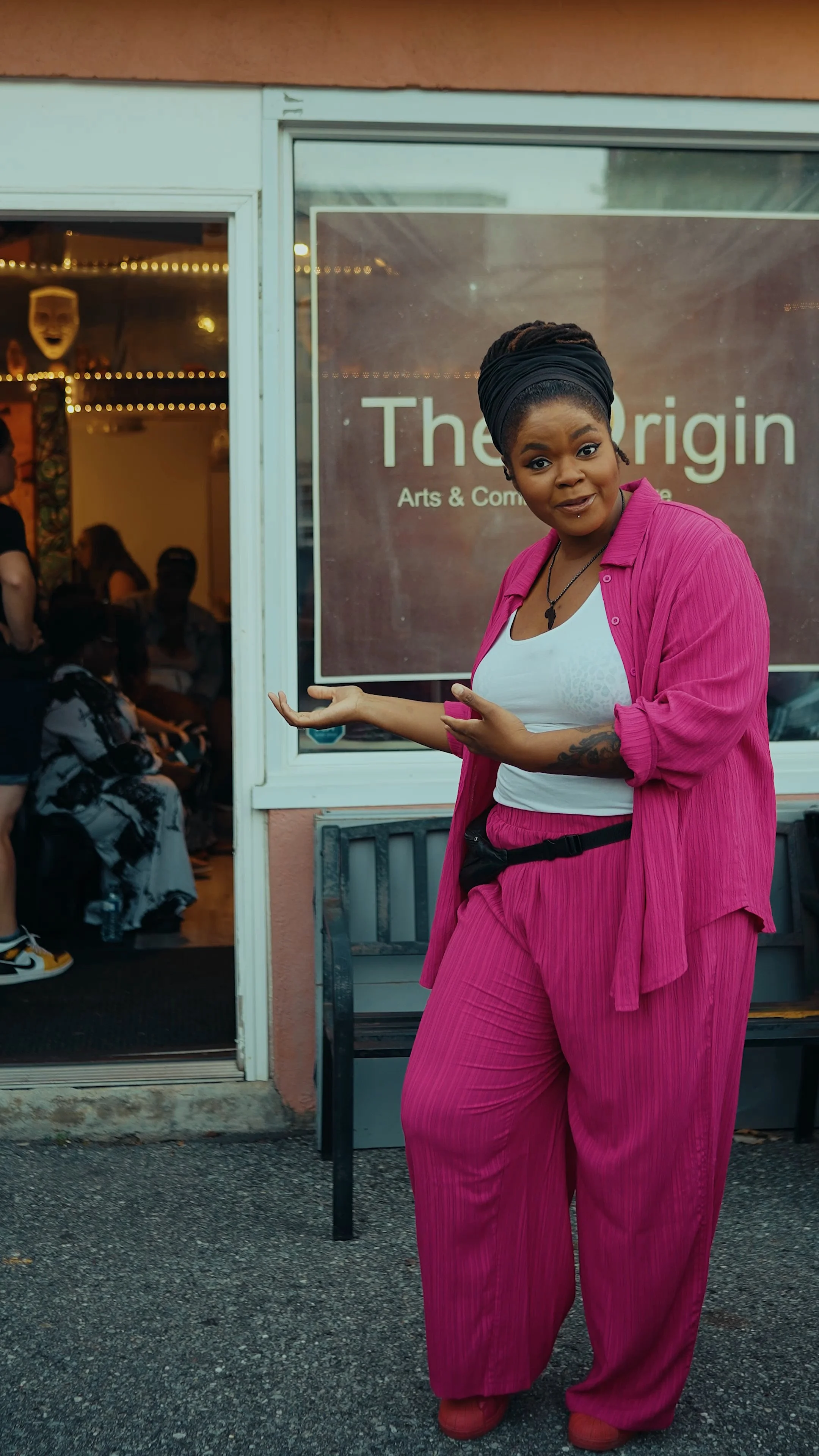 Host gestures to the venue entrance