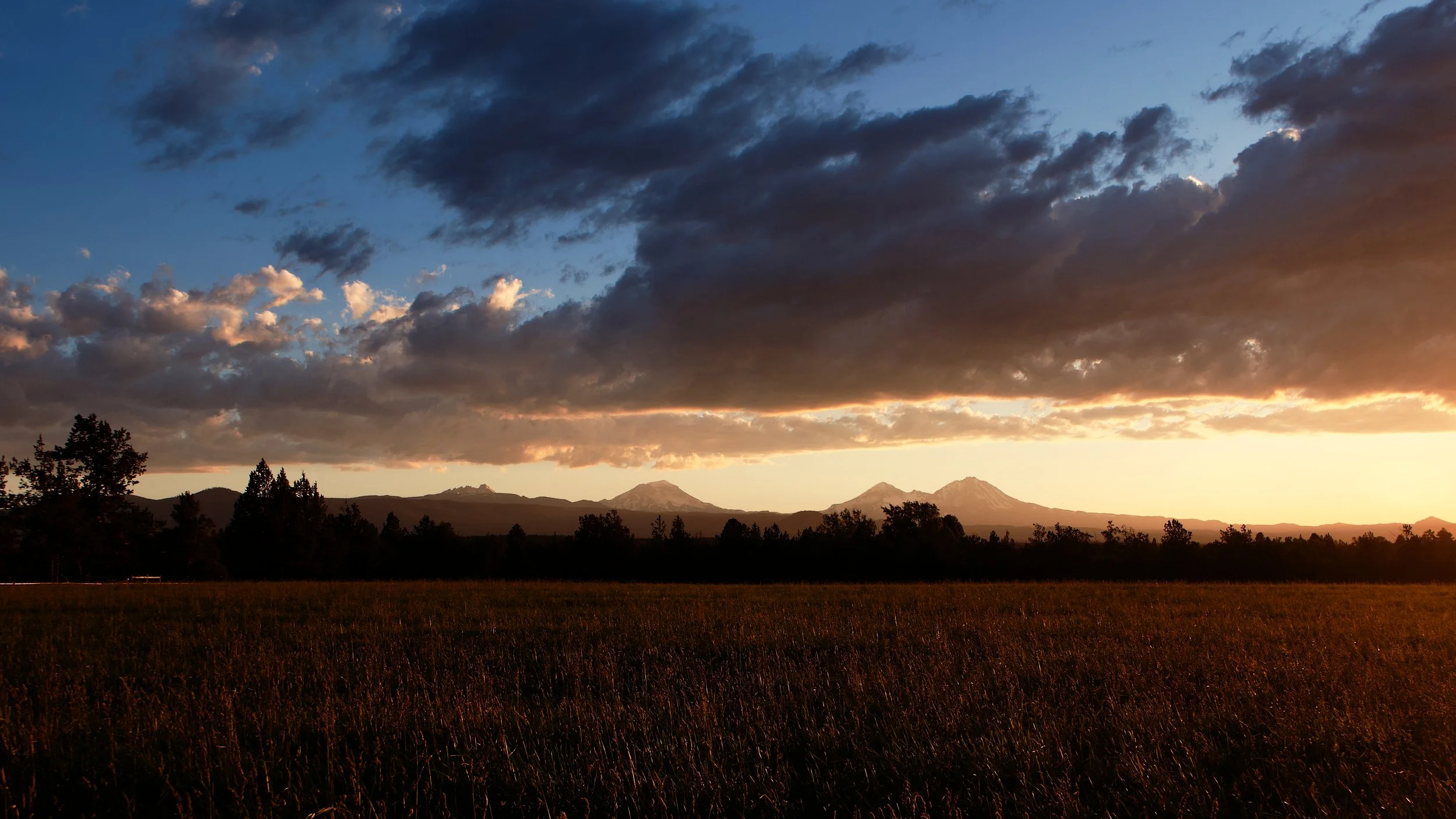 Broken Top and Three Sisters Mountains at Sunset in Central Oregon