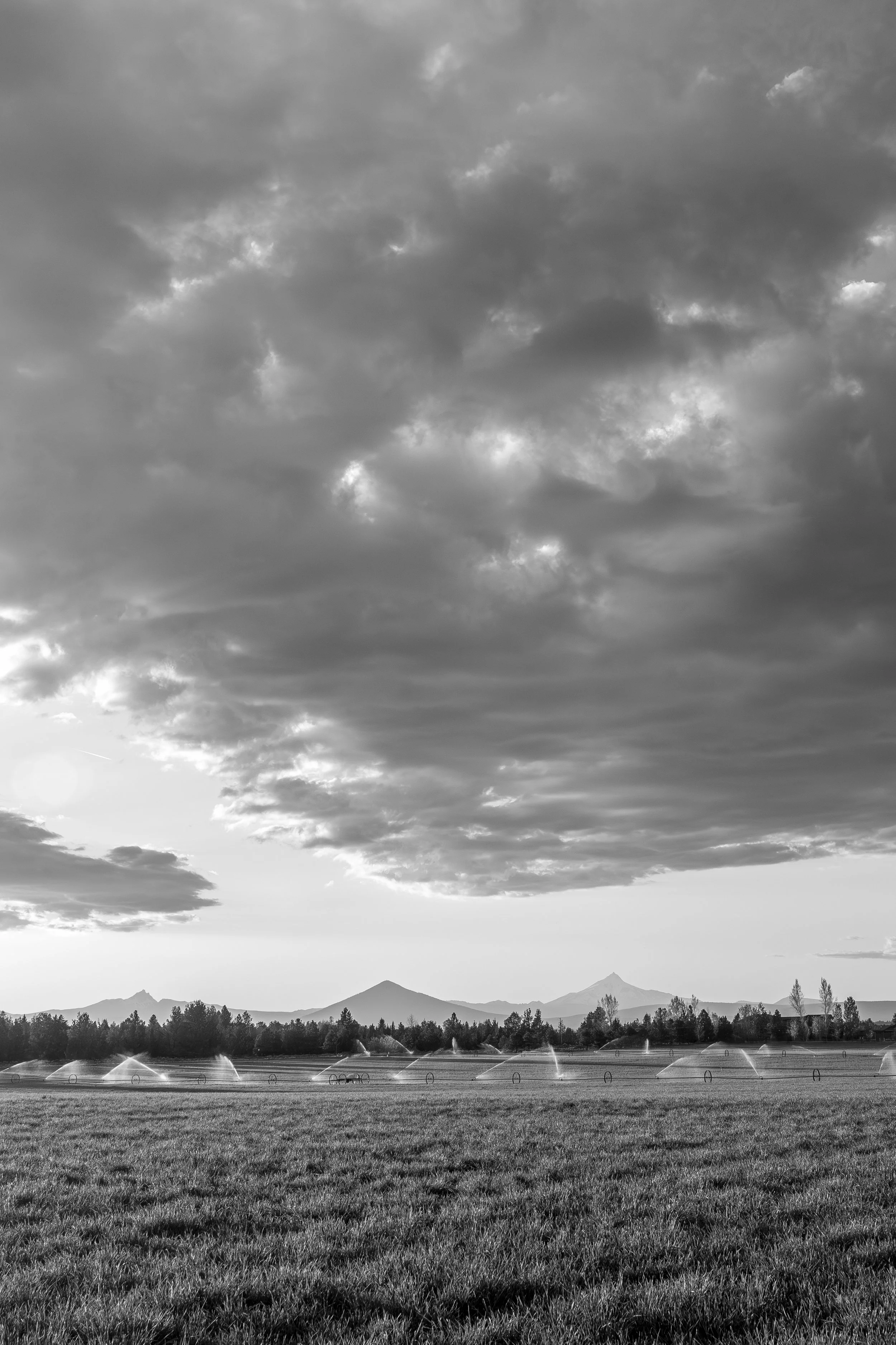 Storm Clouds Above Three Fingered Jack, Black Butte and Mount Jefferson in Central Oregon 