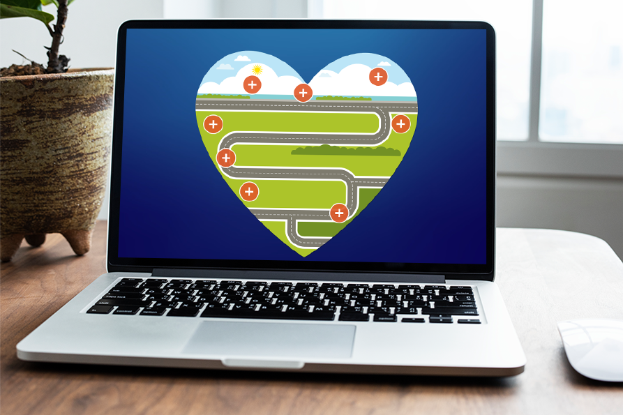 Laptop with an illustration of a winding road inside a heart shape, some clouds, and plus signs indicating positive effects or benefits.