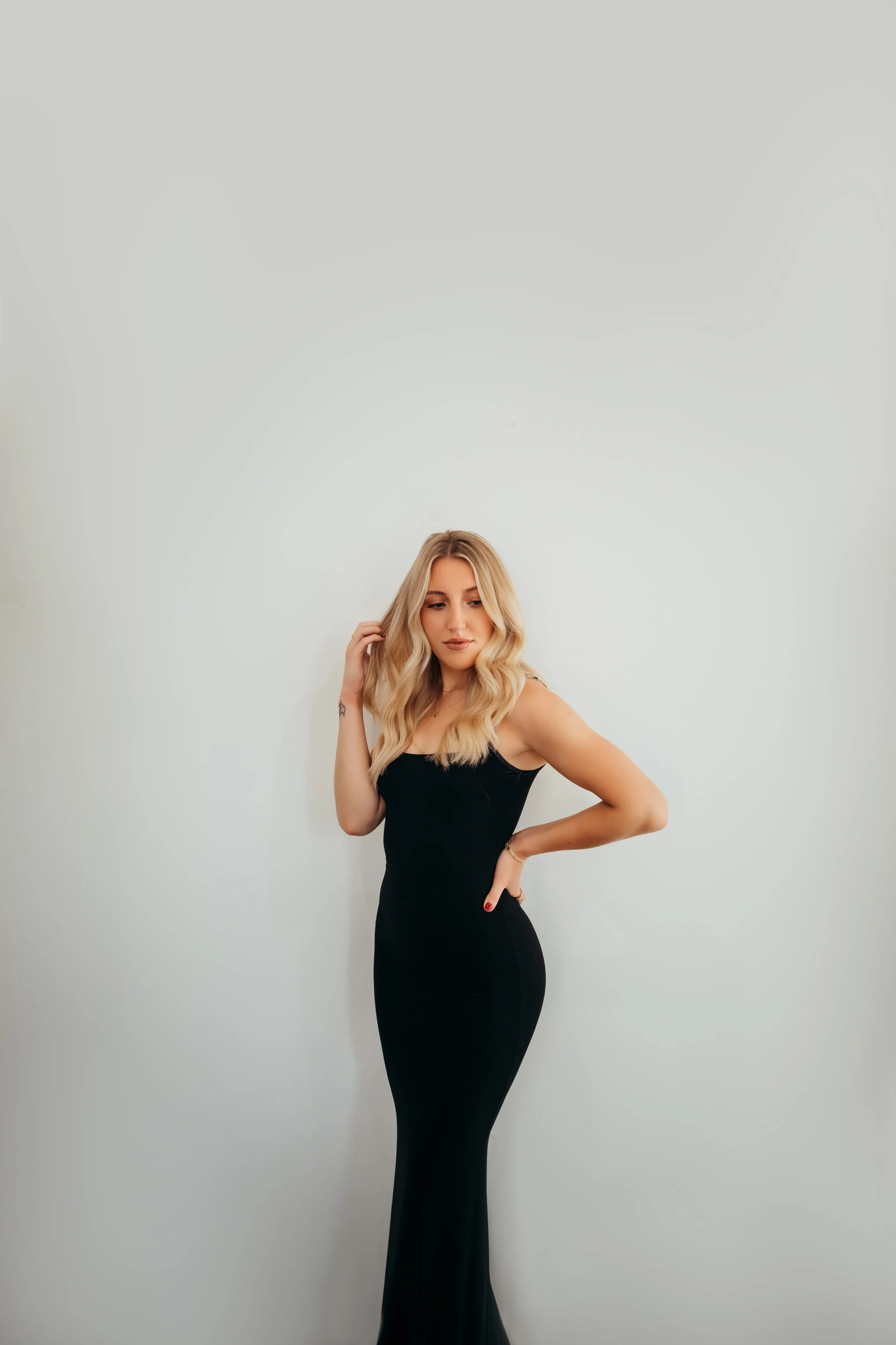 Personal branding photography session in Batavia, NY featuring a woman in a black dress