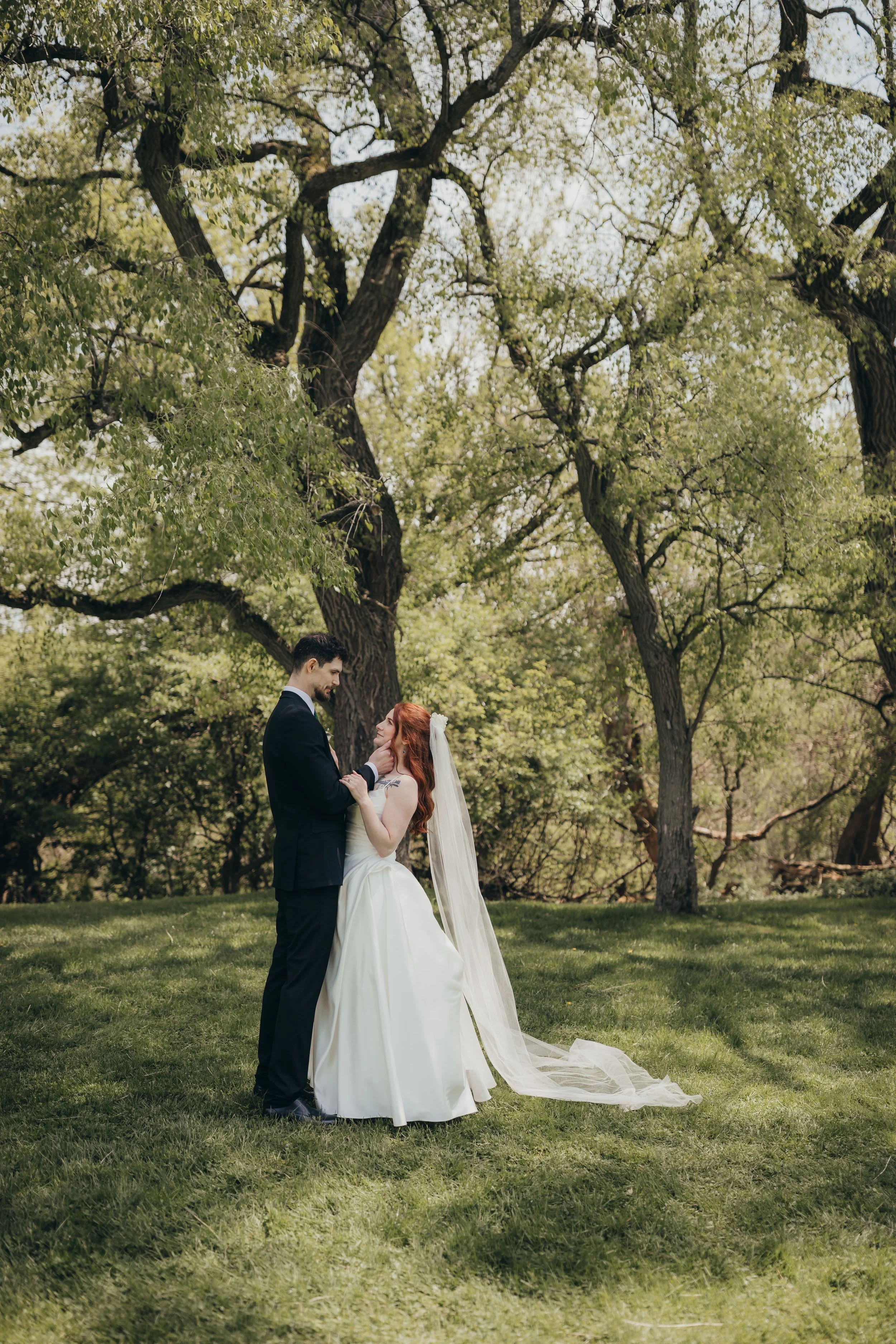 Elegant portrait of bride and groom embracing each other in the moment.