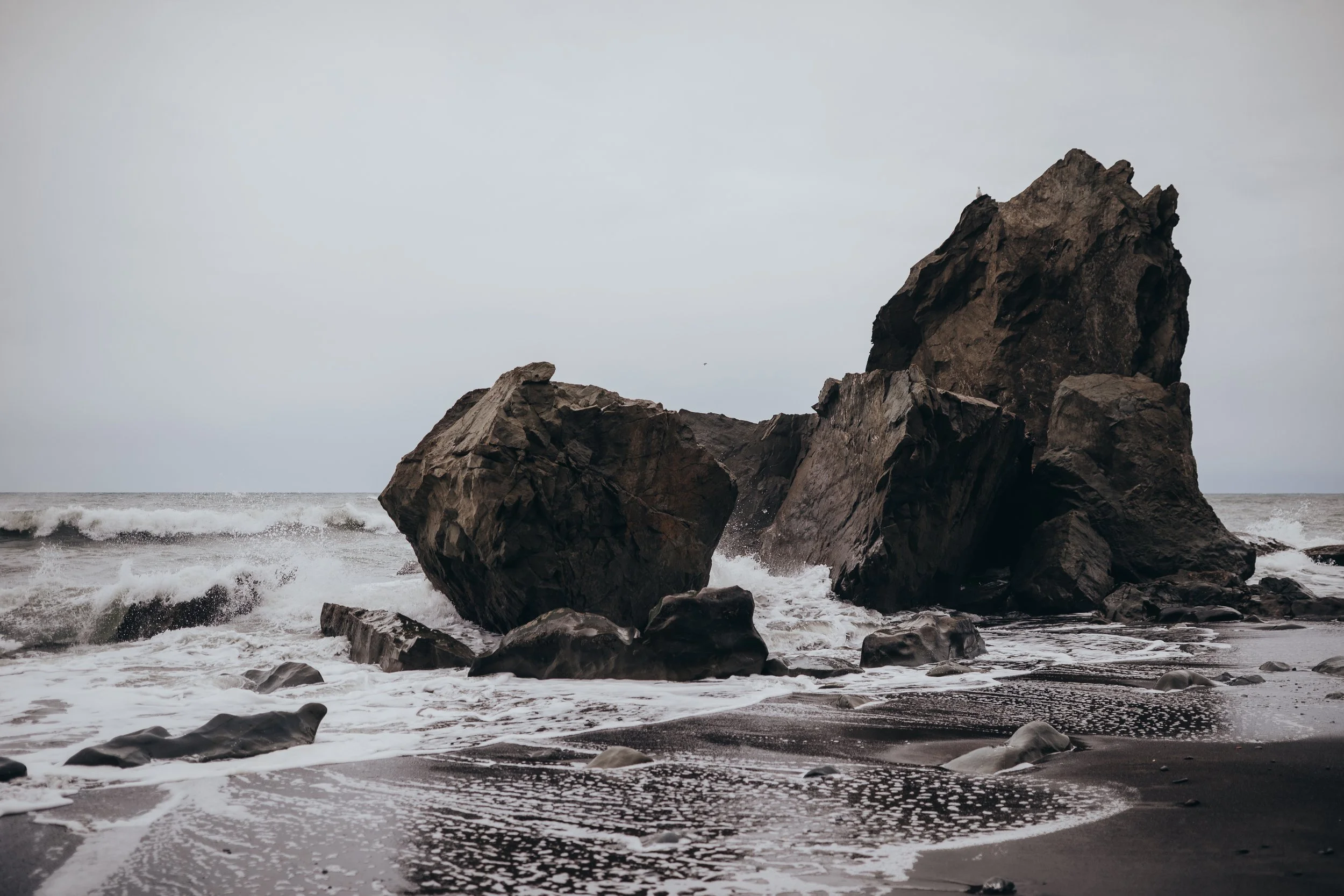 Landscape photography of the waves hitting the rocks on the black sand beaches in Olympic National Park
