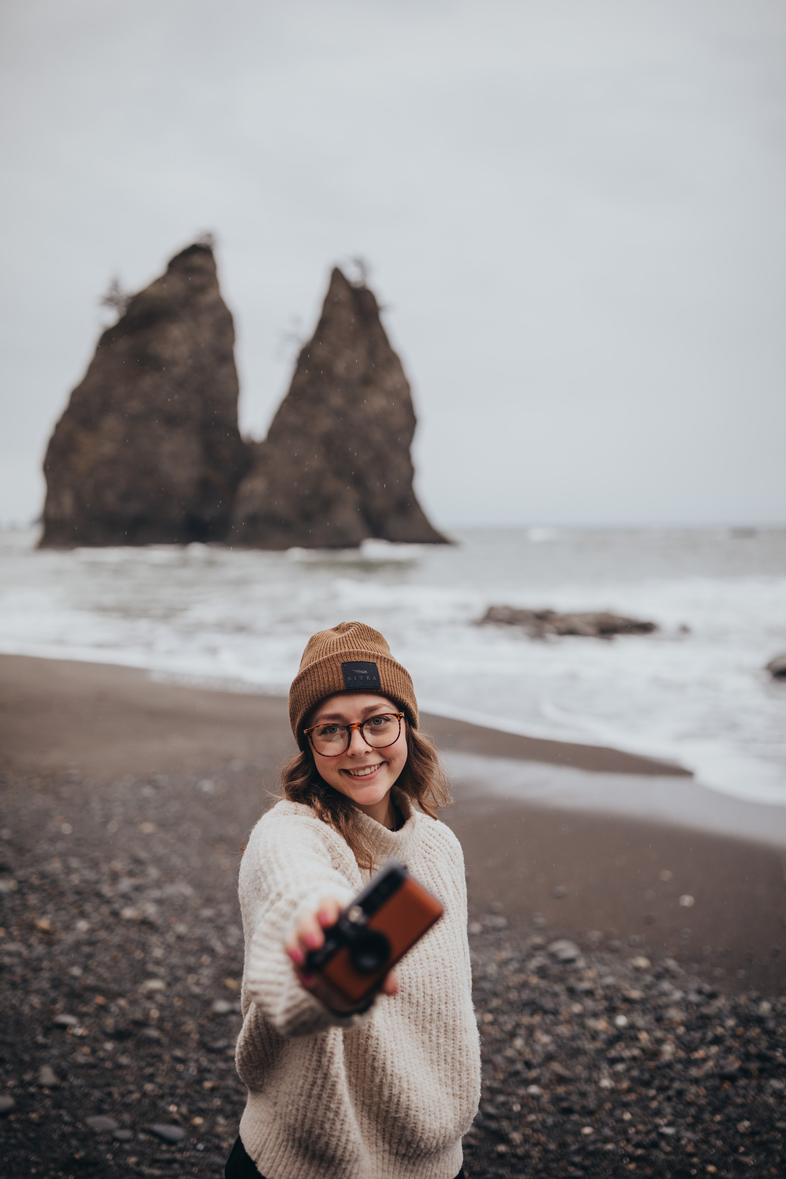 Portrait of a travel photographer at the beach in Olympic National Park