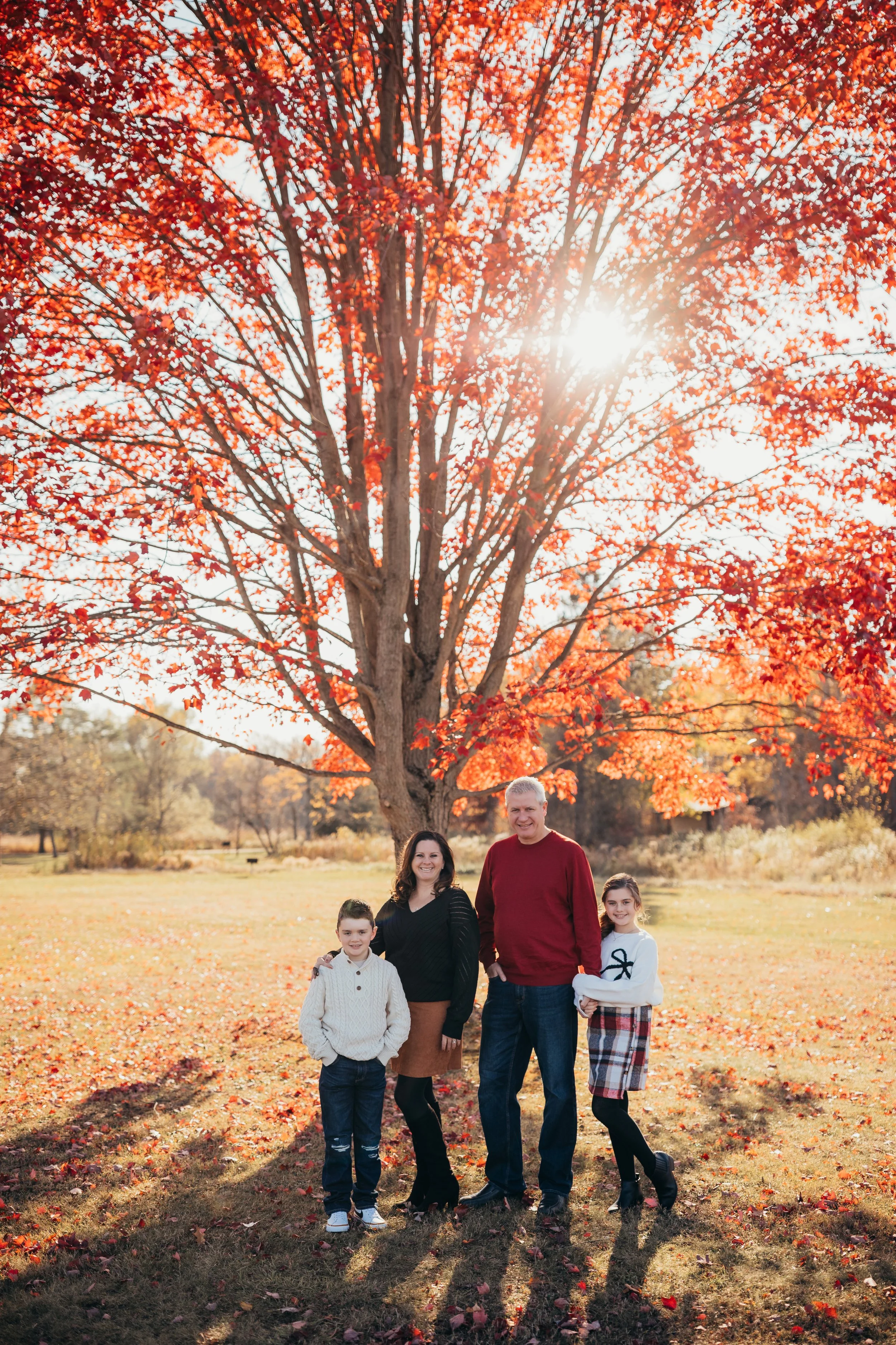 Lifestyle family photography session during the fall in a grassy vibrant field in Rochester, NY