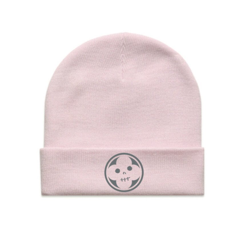professionally shot flat lay of preordered orchid beanie with absolution logo superimposed on front