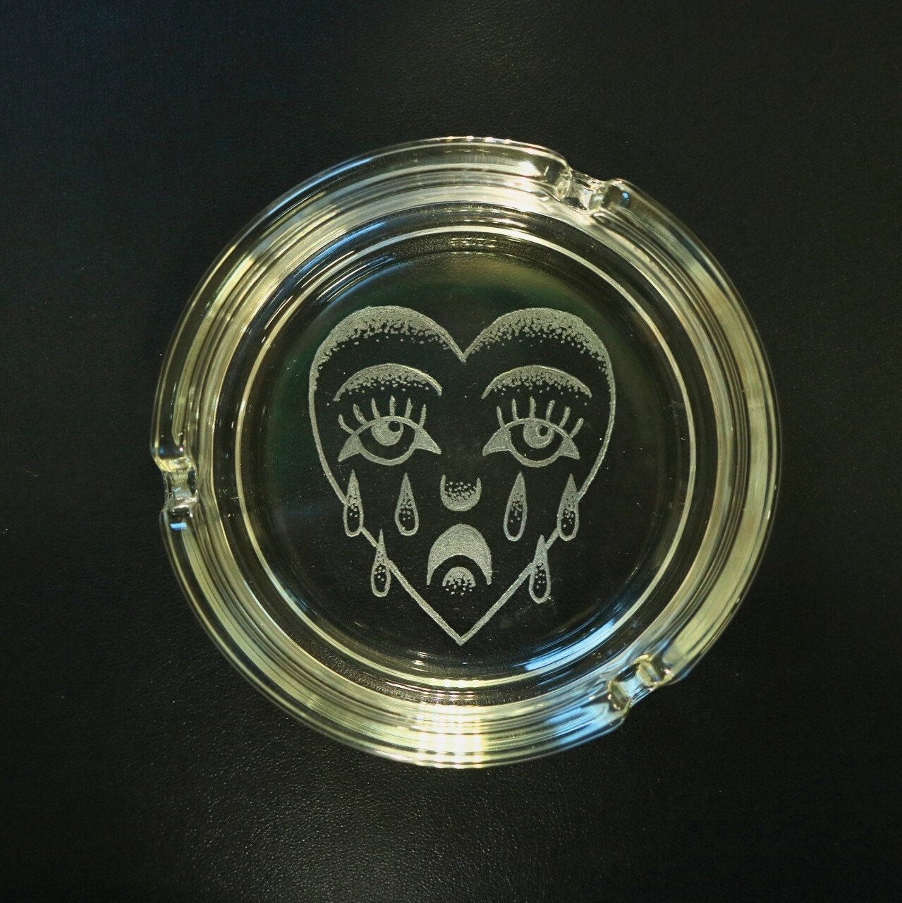 Circular cigar dish with traditional crying heart design by Harry King