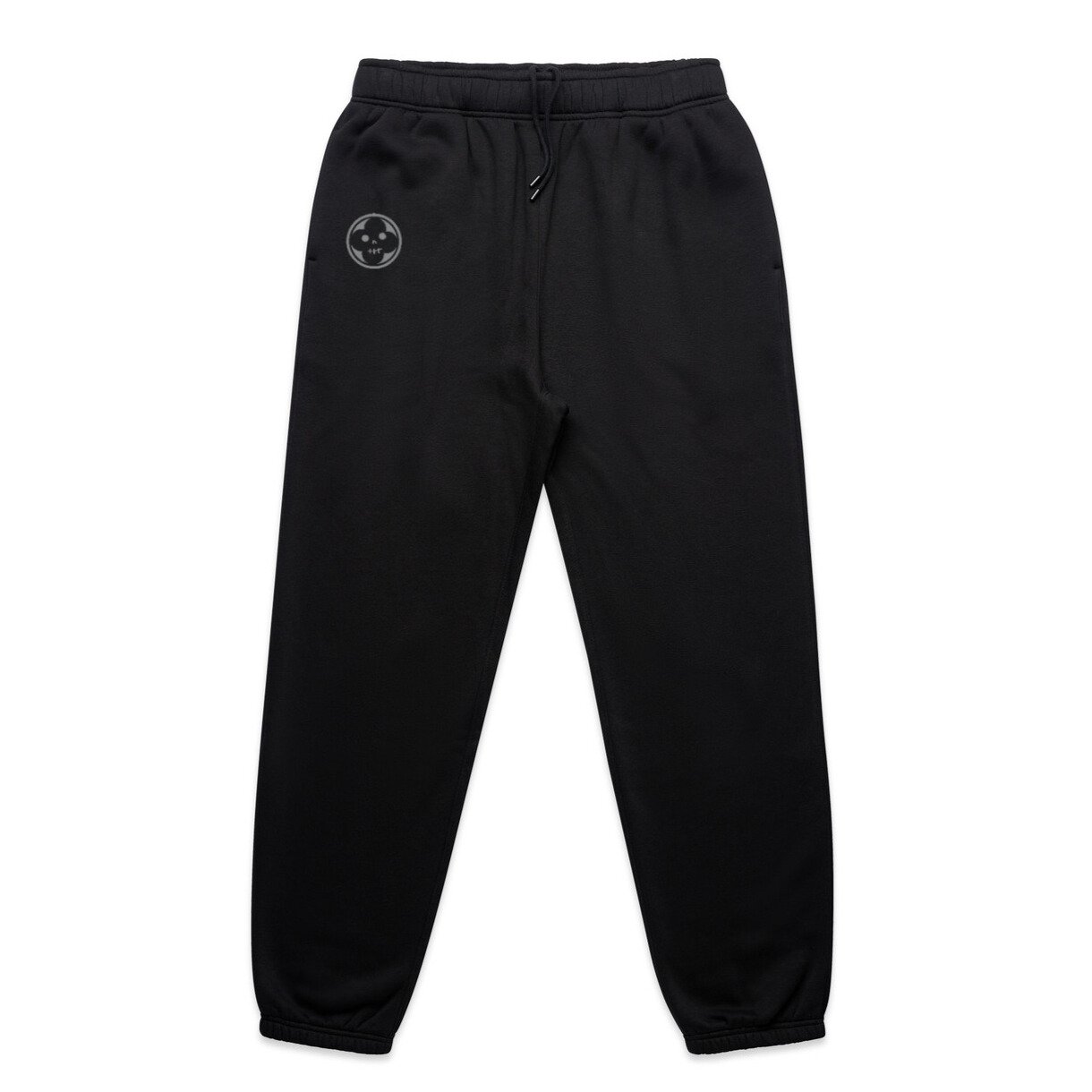 Professional flatlay shot of absolution branded track pants with embroided logo on pocket