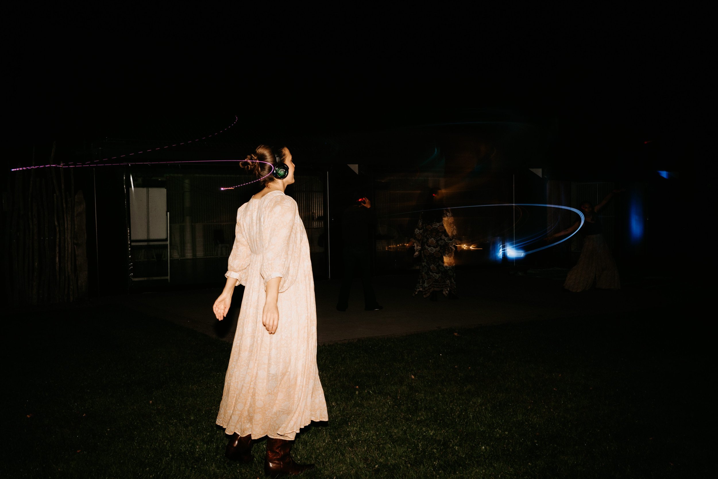 Group of participants moving and dancing in a shared sound journey