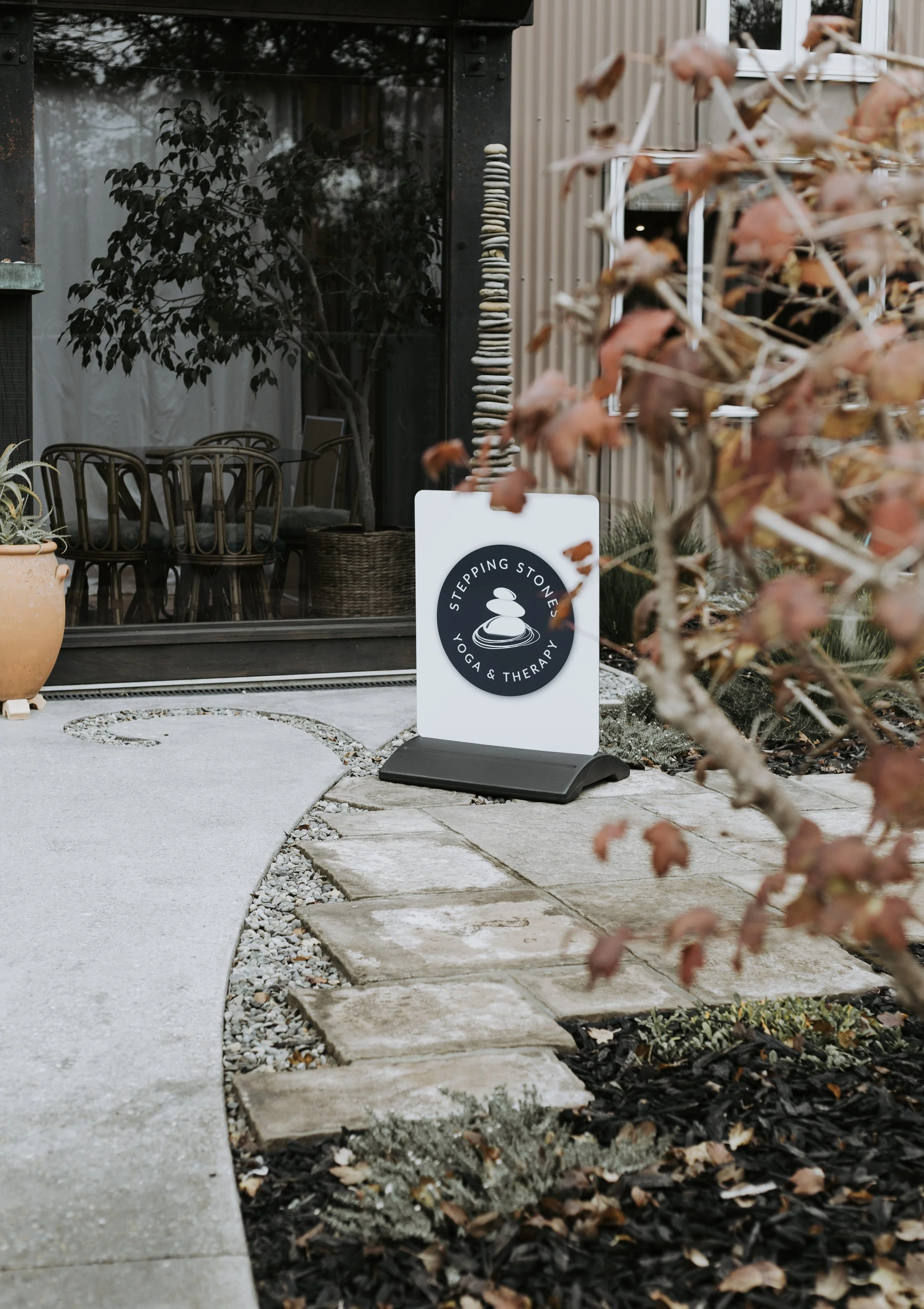 Entrance sign welcoming participants to yoga therapy workshops and retreats in Nelson