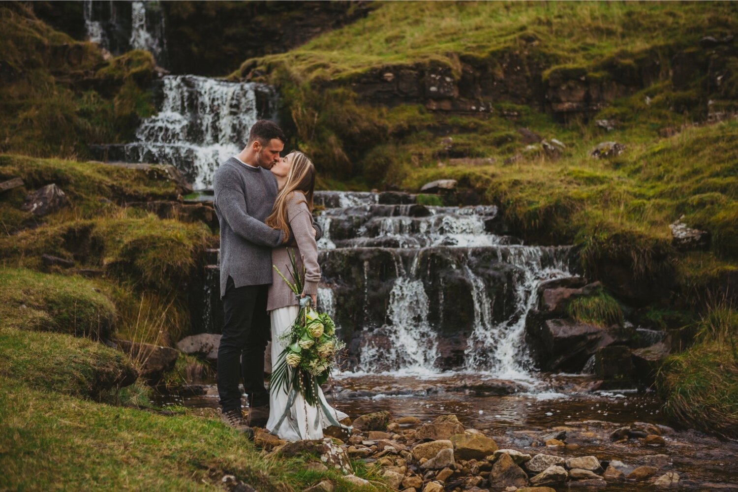 03_TWS-85__grey_dramatic_landscape_alternative_elope_alt_rock_blue_waterfall_winter_flowers_offbeat_dales_waterfalls_autumn_elopement_photography_ribbons_moody_bride_silver_wedding_yorkshire_rainy_cloudy_cosy_weather_photographer_florals_groom.jpg