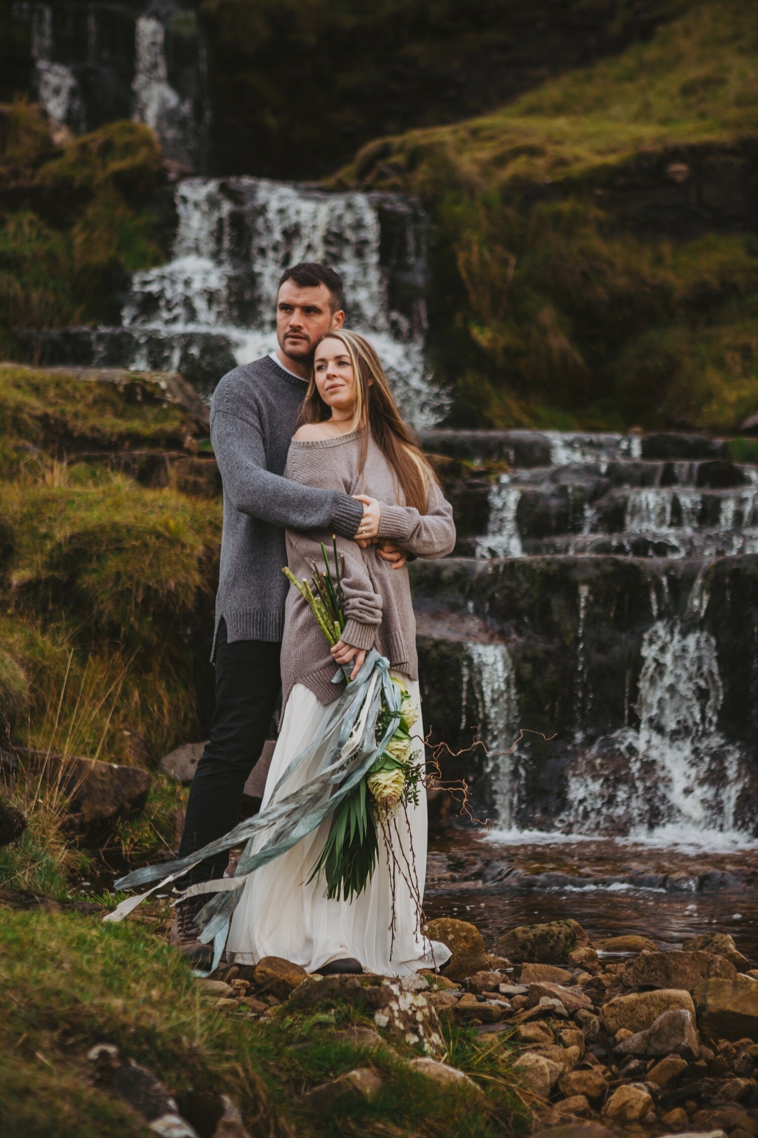 24_TWS-73__grey_dramatic_landscape_alternative_elope_alt_rock_blue_waterfall_winter_flowers_offbeat_dales_waterfalls_autumn_elopement_photography_ribbons_moody_bride_silver_wedding_yorkshire_rainy_cloudy_cosy_weather_photographer_florals_groom.jpg