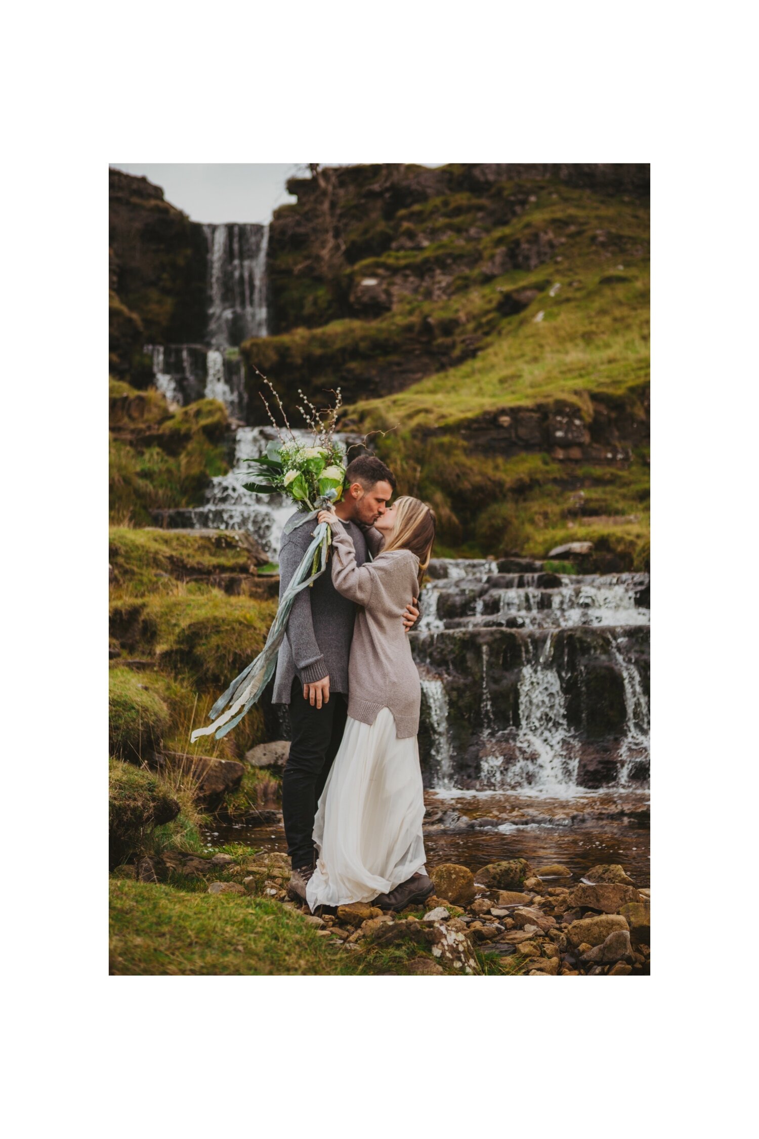 32_TWS-105__grey_dramatic_landscape_alternative_elope_alt_rock_blue_waterfall_winter_flowers_offbeat_dales_waterfalls_autumn_elopement_photography_ribbons_moody_bride_silver_wedding_yorkshire_rainy_cloudy_cosy_weather_photographer_florals_groom.jpg
